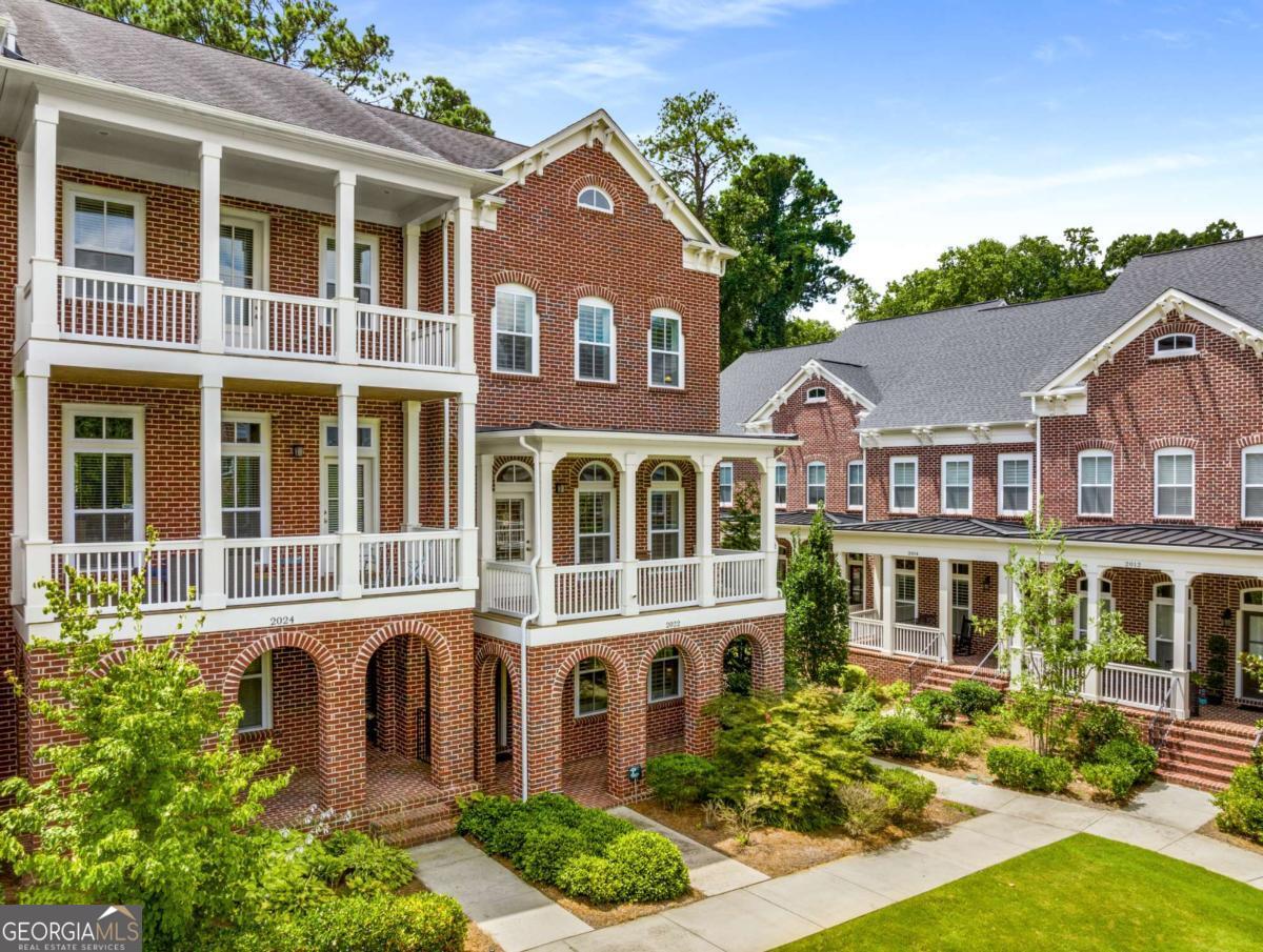 Welcome to this stunning 3-bedroom, 2.5-bath end-unit townhome in the heart the Decatur/Emory area! Featuring $20K worth of premium upgrades and serene views of the community green space, the prime unit in the popular and convenient Mews at North Decatur community is waiting for you! Step inside to discover an open concept layout with abundant natural light, hardwood flooring, and designer touches throughout. The spacious living area flows seamlessly into a modern kitchen featuring granite countertops, stainless steel appliances, upgraded cabinetry, and a stylish tile backsplash. Upstairs, retreat to the oversized primary suite complete with a walk-in closet and beautiful ensuite bathroom. The additional bedrooms are generously sized including a ground floor suite, perfect for guests or a home office. Enjoy multiple outdoor spaces and the convenience of a 2-car garage. Located just minutes from Emory University, the CDC, downtown Decatur, and a wide array of shopping and dining options, this home offers both comfort and convenience at its best!