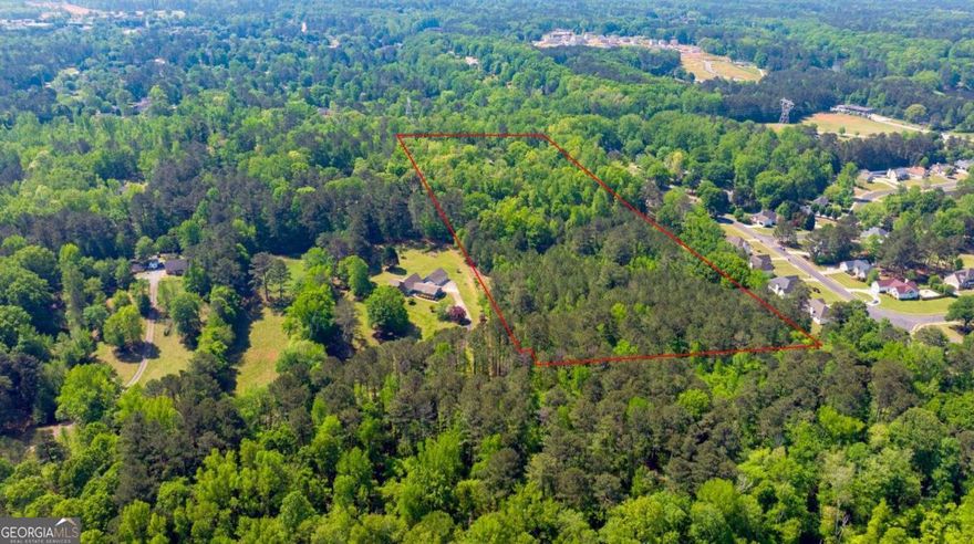 Unlock the potential of 15+ acres of prime Georgia land tucked away on a private, dead-end road, less than 2 miles from I-75 (Exit 222 - Jodeco Rd)! This rare gem offers both seclusion and unmatched convenience-just 1 mile from top-tier retail including Costco, Starbucks, Chick-fil-A, Sprouts, Whataburger, Chipotle, and more.    Currently, there's a 3 bed / 3 bath home on the property, but the real value lies in the land-partially cleared and brimming with opportunity. Whether you envision a residential enclave, or a custom-built community, or a private estate, or a family compound the canvas is yours. Plus, it's close to the new Western Parallel Connector, offering streamlined access to Hudson Bridge, Jodeco, and Jonesboro Rd.    Buyers must conduct their own due diligence on zoning and usage, but the location and potential are undeniable. With the rapid growth in Henry County, this is your chance to capitalize on one of the area's most promising tracts and developing area of Jodeco Rd.
