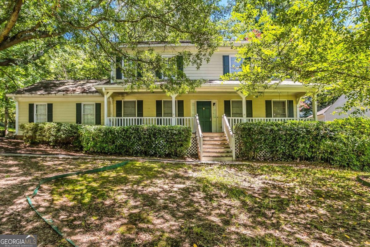 Discover this beautifully split-level home nestled in the quiet, established Summit Chase neighborhood. The inviting layout features a sun-filled enclosed porch, a spacious living room with a cozy fireplace and built-in bookcases, and a separate dining area perfect for hosting. The kitchen includes a breakfast bar and a dedicated breakfast nook, blending functionality with comfort. Upstairs, the primary suite offers dual closets and a private bath, while two additional bedrooms provide space for guests, family, or a home office. Outside, enjoy a private, fenced backyard ideal for relaxing or entertaining. Located just minutes from shops, parks, and dining, this home combines classic charm with modern convenience.