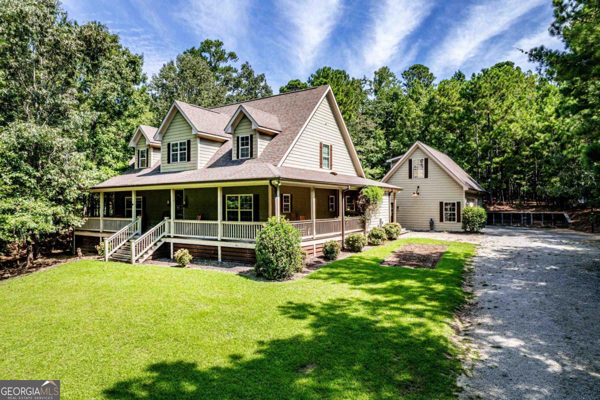 HOME FOR SALE ON SOUGHT AFTER RICHLAND SIDE OF LAKE OCONEE. Experience lake life living in this beautiful 4-bedroom, 2.5-bath home at Lake Oconee. Nestled on a private 2 acre lot in a quiet subdivision, this property is the perfect retreat for relaxation. This home provides the sought after Kitchen, Living Room, and Dining Room Combo making it ideal for entertaining. Located on the Richland side of Lake Oconee, you'll enjoy tranquil surroundings, and community amenities. A well-maintained subdivision with exclusive lake access, residents can enjoy boating, fishing, and waterfront recreational activities just steps from their front door. Whether you're looking for a full-time residence, vacation home, or investment property, this exceptional Lake Oconee home combines privacy, convenience, and the natural beauty of one of Georgia's premiere lake destinations. Don't miss the opportunity to own this property in a highly desirable location!