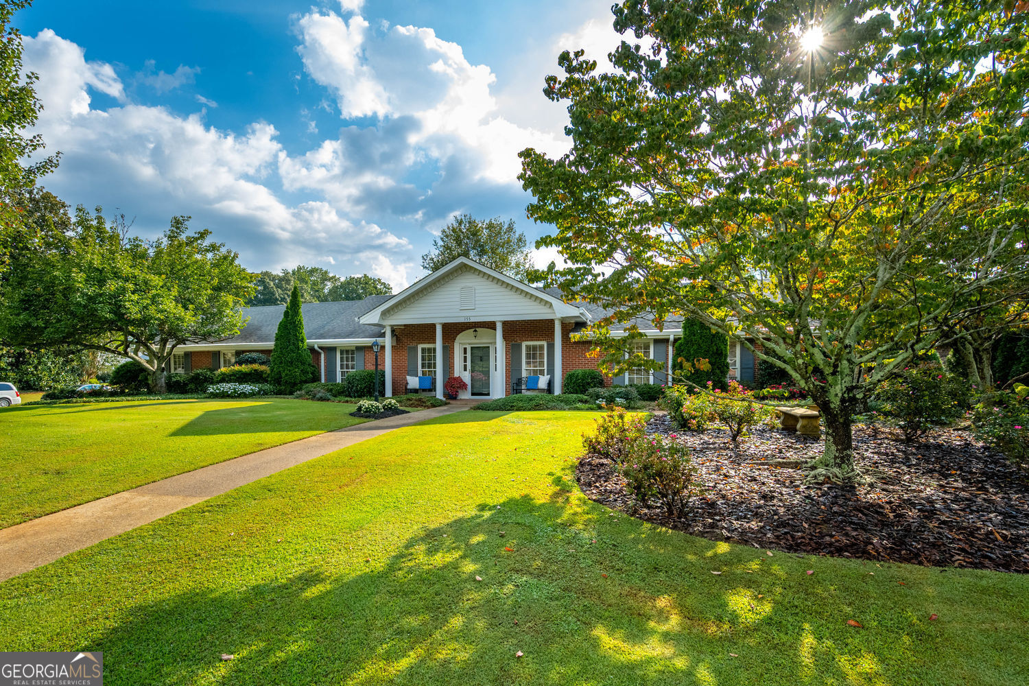 A move-in ready, beautifully updated home of this caliber is a rare treasure. Lovingly maintained and quality-built by Chathambilt, this timeless 4-sided brick ranch offers effortless one-level living that is classic and welcoming. Elegant appeal as it sits on a large, level lot, the home greets you with a front porch. Inside, a spacious great room and dining room, complete with a butlers pantry, set the stage for gatherings. The updated eat-in kitchen, open to a charming keeping room, is the heart of the home and flows seamlessly onto an expansive covered patio-perfect for entertaining. The primary suite is down the hall, joined by two secondary bedrooms with generous walk-in closets and a shared Jack-and-Jill bath. A heated and cooled artist's studio off the garage provides a serene retreat for creative work, or home office. Step outside into a backyard sanctuary. The fenced, level lot is enhanced with grassy yard, professional landscaping, mature trees, and unexpected details including a garden door, arched arbor, stone paths, and inviting sitting areas. The rear-entry garage is outfitted with a workshop and storage closets. Additional driveway parking. Permanent attic stairs add easy-access storage. Beyond the property, you are just minutes from award-winning schools, plus dining and events in Historic Roswell, Crabapple, and Downtown Alpharetta. Outdoor enthusiasts will appreciate Roswell's award-winning parks, trails, and recreation. Don't miss the easy access to every type of shopping and GA 400. It's the kind of place you can't help but fall in love with. (Please note the owner has a Georgia real estate license.)