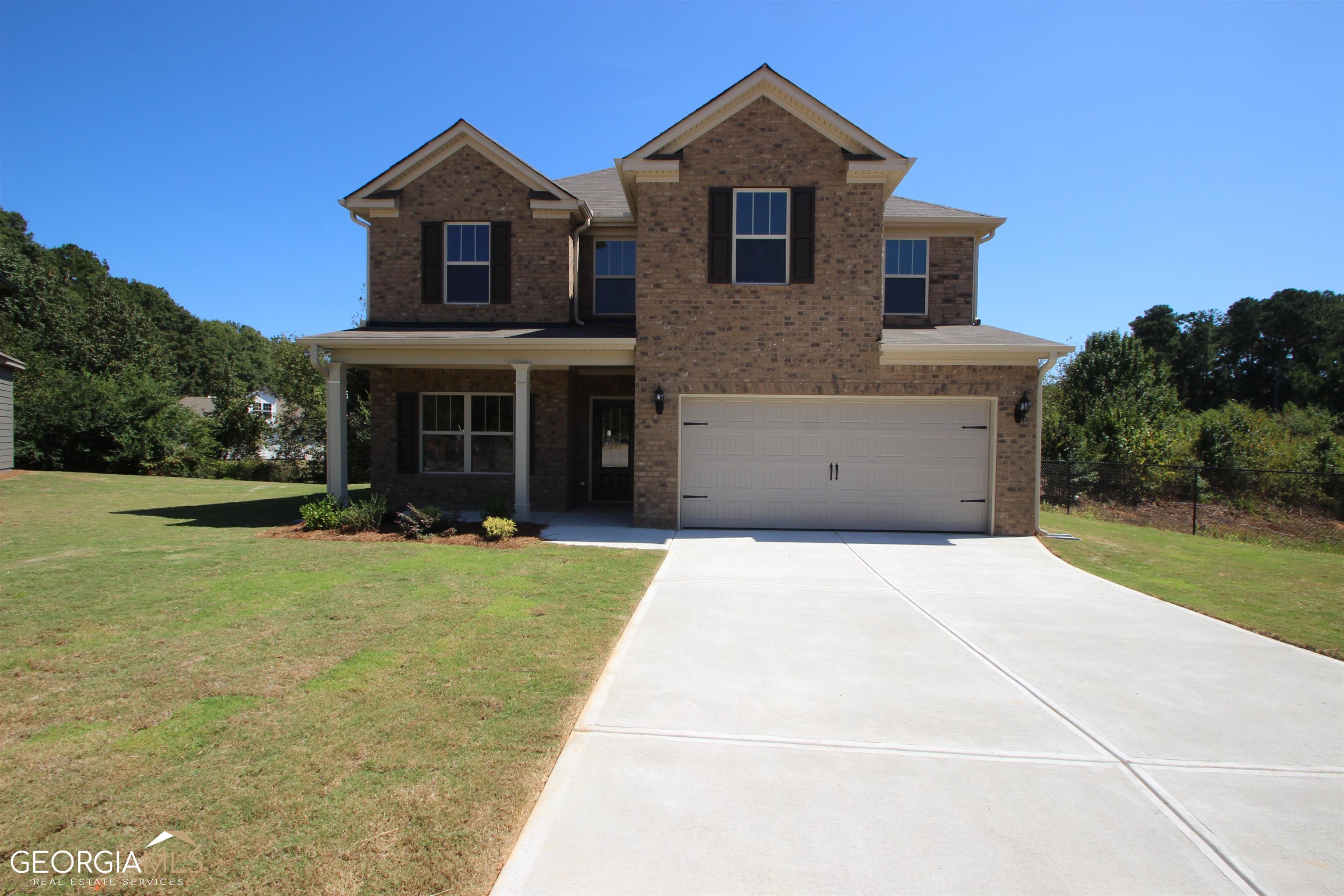 Lot 87 - The Magnolia | 4BR / 2.5BA Presented by Capshaw Homes | Ready November 2025 NO HOA | Sprawling 2-Acre Private Homesite Come on home to where Southern charm meets everyday comfort. The Magnolia invites you to settle into life on nearly 2 acres of peaceful, private land-just minutes from downtown Locust Grove, Tanger Outlets, and I-75 at Exit 212. This thoughtfully designed 4-bedroom, 2.5-bath beauty offers an open-concept layout perfect for gathering with family and friends. Enjoy spacious bedrooms, a generous kitchen, and scenic views of Georgia's natural landscape right outside your window. Whether you're rocking on the porch or hosting Sunday supper, this home is made for the kind of living that feels just right. Experience true Southern living-gracious, grounded, and surrounded by nature. Call today for more details: 678-698-6971