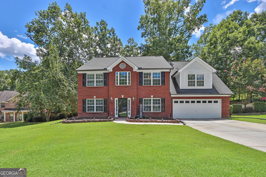 Welcome to this beautifully updated and meticulously maintained 4-bedroom, 2.5-bathroom home, perfectly situated on a quiet cul-de-sac just 5 minutes from Hwy 316-ideal for an easy commute! Step inside to the 2-story foyer to find vaulted ceilings that create an open, airy feel, and enjoy tasteful updates throughout that make this home truly move-in ready. The spacious floor plan offers room for everyone, with generous living spaces and natural light flowing throughout. The large fenced-in backyard is perfect for pets, play, or entertaining guests. Major updates include a new roof (October 2021), new hot water heater in 2023 and one HVAC unit replaced in 2022, providing peace of mind for years to come. Don't miss this opportunity to own a stylish, low-maintenance home in a great location with quick access to schools, shopping, dining, and commuter routes. Schedule your showing today-this gem won't last!