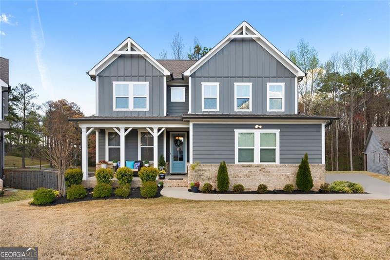 Welcome to this beautiful Craftsman-style home nestled in the highly desirable Mountain Brook subdivision, known for its resort-style amenities and picturesque surroundings. As one of the most sought-after communities in the area, Mountain Brook boasts one of the largest clubhouses in the county, swim , tennis and pickleball courts, and scenic walking trails around a serene lake-all just steps from your front door. Main Level Highlights: * A spacious bedroom on the main level, ideal for a guest suite or private home office * An open-concept kitchen and living room, perfect for entertaining * Chef's kitchen featuring white cabinetry, quartz countertops, stainless steel appliances, and a large island designed for gathering * Living room with a cozy fireplace and ample space for relaxation * Separate formal dining room, perfect for hosting holidays and special occasions * Located on a cul-de-sac lot, offering a safe and private space for children to play Upper Level Features: * Luxurious primary suite with a spa-like en-suite bathroom, featuring double vanities, and a large tiled shower * Two additional bedrooms, including one with its own private bath-perfect for a second guest suite or teen retreat * Versatile loft/sitting area, ideal for a playroom, media space, or reading nook Outdoor & Additional Features: * Back deck overlooking a private, wooded lot, perfect for relaxing evenings or morning coffee * Conveniently located near shopping, dining, and top-rated schools This stunning home in Mountain Brook offers the perfect balance of luxury, comfort, and community living. Don't miss your chance to experience it firsthand-schedule your private showing today!