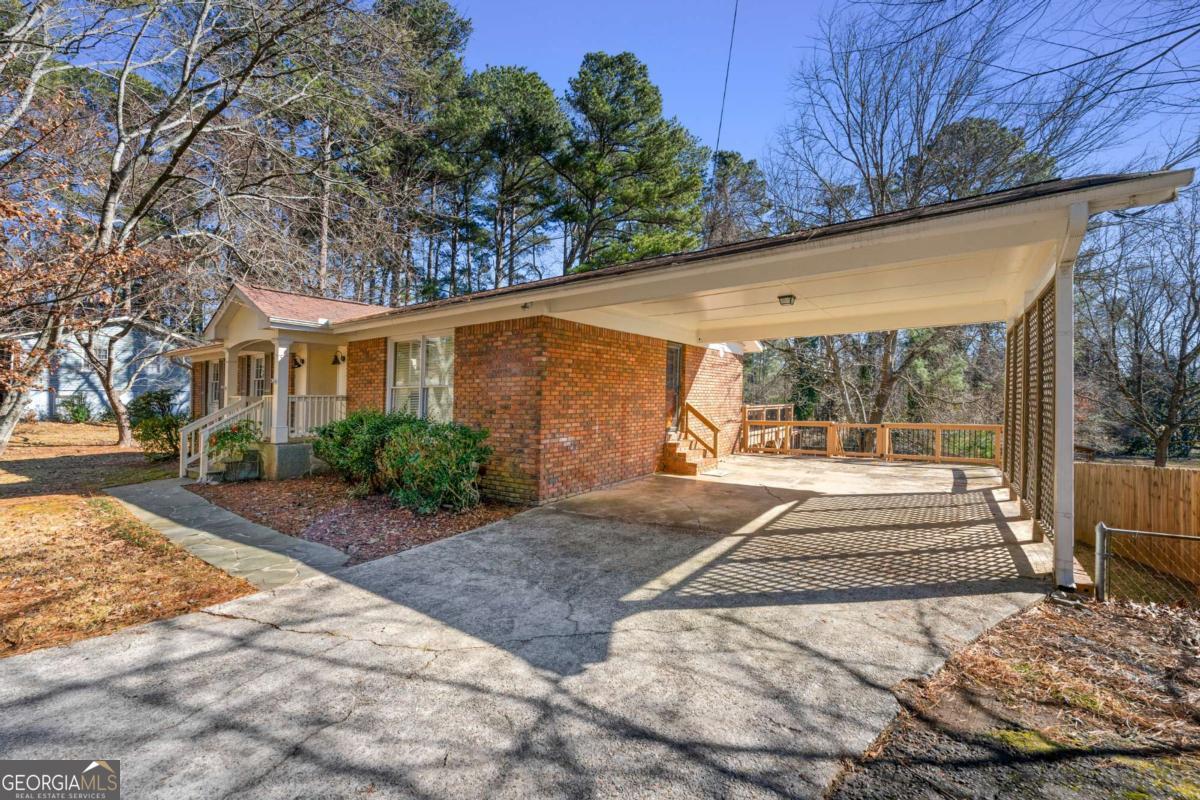 Welcome to this well maintained 4-sided brick gem with charming interior features and a new huge double tiered deck! The rear of the home has a spacious Sunroom addition with access to the deck. Hardwoods throughout the main level with open concept living space. The partially finished basement has a ready to use workshop and a full size garage door to the back yard. Don't miss this lovely home in the Pope HS district!