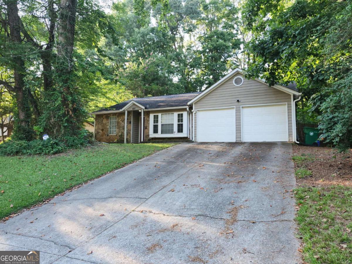 Charming 3-Bedroom Home with Endless Potential - Offered As-Is! Discover the possibilities in this spacious three-bedroom, two-bath home featuring a large primary suite with its own cozy sitting area, perfect for relaxing after a long day or a personal space for a small gym. This home also features a spacious sunroom, perfect for use as a home office, gym, playroom, or relaxing lounge area. With a little TLC, this property becomes a fantastic opportunity for investors or buyers ready to add their personal touch. Step outside to your private backyard oasis, where a large 40 x 20 ft in-ground pool awaits restoration. With a bit of care, it could be the highlight of your outdoor living space, ideal for entertaining or unwinding in your own retreat. Recent updates include a 7-year-old roof, new water heater, new garbage disposal, and a new microwave range hood. With a little TLC, this home presents an excellent opportunity for investors or buyers looking to customize a space to their liking. Located within 5 miles of top attractions, including: Stone Mountain Park, Stone Mountain Scenic Railroad, ART Station (Contemporary Arts Center & Theater). Don't wait to bring your vision and creativity to life- transform this house into the home of your dreams!