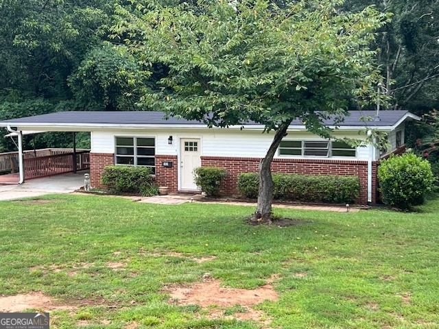 This one will not last long. What a great opportunity to own a 4-sided brick home in a quiet little community with no HOA and just about a mile from Old Town Conyers. This place is just adorable and has so much potential. The roof, floors and interior paint are all brand new. It has a great side porch to sit and enjoy your morning coffee or evening drinks of choice or sit on the back porch and look out over the 1.79 acres while soaking up the peace and serenity. Washer, dryer, and refrigerator stay with the house (and all other furnishings are negotiable!). This place is just perfect and won't last long so schedule your showing today!! Do not approach home without an appointment.