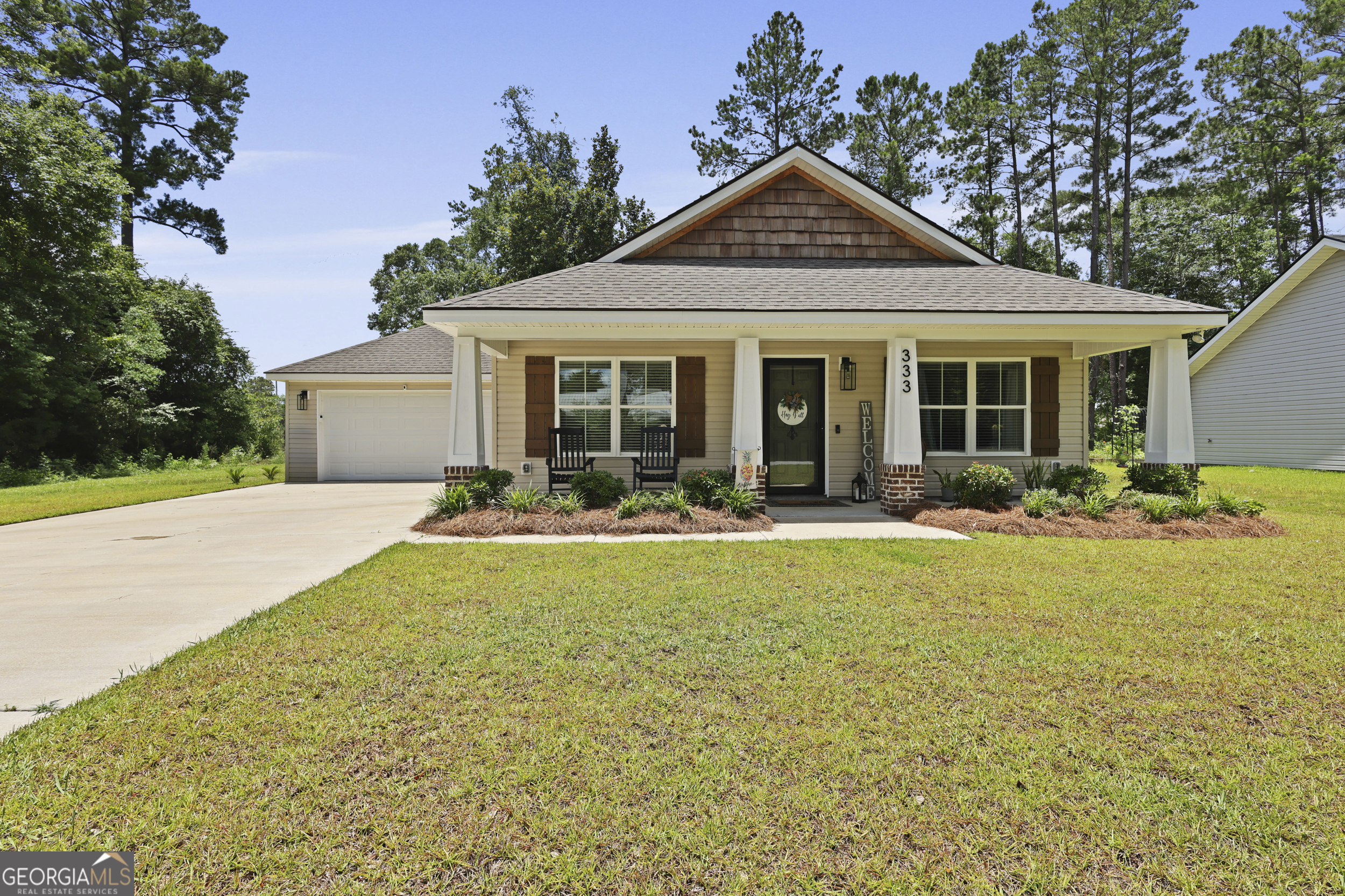 Welcome to 333 Dreamland Street-where charm, quality, and convenience meet. Built in 2023 by Overholt Construction, this beautifully maintained Craftsman-style home still feels brand new. Just minutes from downtown Jesup, it offers both style and location in one inviting package. Inside, you'll find 3 spacious bedrooms and 2 full bathrooms spread across 1,320 square feet. The open eat-in kitchen is perfect for gatherings, while LVP flooring adds durability and modern flair throughout the main living areas. Cozy carpet in the bedrooms creates a warm and restful retreat, and the large laundry room adds everyday practicality. Additional features include generous closet space, an attached 2-car garage, a landscaped yard for easy outdoor enjoyment, and a termite bond that is already in place. Whether you're looking for a move-in ready home or a newer build close to town, this one checks all the boxes.