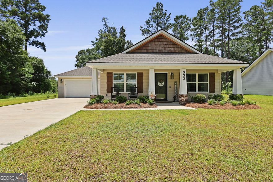 Welcome to 333 Dreamland Street-where charm, quality, and convenience meet. Built in 2023 by Overholt Construction, this beautifully maintained Craftsman-style home still feels brand new. Just minutes from downtown Jesup, it offers both style and location in one inviting package.    Inside, you'll find 3 spacious bedrooms and 2 full bathrooms spread across 1,320 square feet. The open eat-in kitchen is perfect for gatherings, while LVP flooring adds durability and modern flair throughout the main living areas. Cozy carpet in the bedrooms creates a warm and restful retreat, and the large laundry room adds everyday practicality.    Additional features include generous closet space, an attached 2-car garage, a landscaped yard for easy outdoor enjoyment, and a termite bond that is already in place.     Whether you're looking for a move-in ready home or a newer build close to town, this one checks all the boxes.