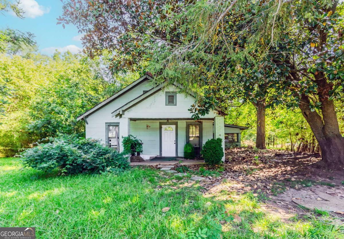 Charming Fixer-Upper on 1.4 Acres Bring your vision to this unique property located along the growing Commerce Road corridor in Athens! Set on approximately 1.4 acres, this property offers both space and opportunity. The existing home features two bedrooms and one bathroom, ready for a full remodel or creative reimagining. Highlights: Spacious Lot: Nearly an acre and a half with room for gardening, outdoor living, or future expansion. Renovation Potential: The home is in need of updates, making it an ideal canvas for investors, flippers, or homeowners looking to add value. Location Advantages: Convenient access to Hwy 441/Commerce Rd and just minutes to shopping, dining, and the University of Georgia. Versatility: Plenty of land for storage, workshops, or small homestead living.