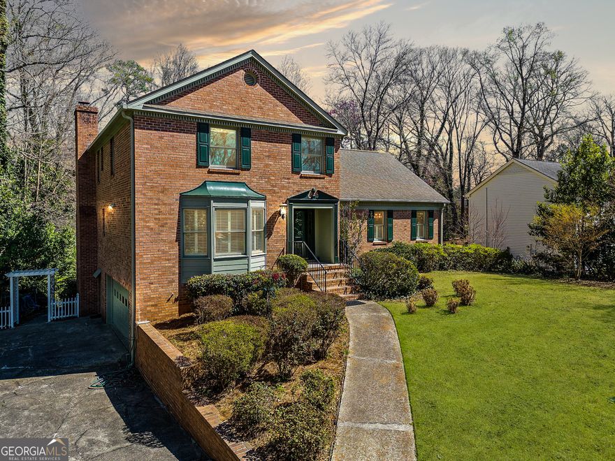 Welcome Home to Gant Quarters/Millbrook Farms    Tucked away in the sought-after Gant Quarters/Millbrook Farms community, this stunning brick home offers the perfect blend of tranquility and convenience. Set at the end of a quiet cul-de-sac, it provides a private retreat among mature hardwoods while keeping you close to I-75/I-285, The Battery at Truist Park, three Chattahoochee River parks, Terrell Mill Recreation Center, and East CobbCOs best shopping and dining.    From the curb, timeless brickwork and designer landscaping create an inviting first impression. Step inside the foyer, and youCOll find an elegant balance of charm and function, with multiple spaces designed for gathering and entertaining. A formal sitting room sets a refined tone, while the spacious family roomCowith custom built-ins and a brick wood-burning fireplace (plus a gas starter)Coinvites you to relax. A third flexible living area can serve as a playroom, guest suite, or home office, complete with its own full bath.    The heart of the home is a chefCOs dream kitchen, thoughtfully updated with a Wolf gas stove-topped island, double ovens, endless counter space, and custom solid cherry cabinetry. A large, elegant dining room easily accommodates a 12-seat table and buffet, perfect for hosting neighborhood dinner clubs and holiday gatherings. Just behind the kitchen, a combined laundry and pantry space offers extra storage and a private half bath for added convenience.    Step outside to a peaceful screened sunroom, perfect for morning coffee, or fire up the grill on the deck overlooking the fenced, grassy yardCoa natural oasis with plenty of room to play and entertain.    Upstairs, five oversized bedrooms include an updated primary suite with walk-in storage and two additional full baths. Need more space? Head downstairs to the finished basement, featuring a second fireplace, a cozy den, workout and office areas, a dedicated workshop, and a huge garageColarge enough to fit cars and even a bass boat.    Thoughtful upgrades like custom plantation shutters, glowing solid hardwood floors, high-end windows, and exquisite millwork add to the homeCOs warmth and character. Spacious yet efficient, polished yet invitingCothis is a rare gem in one of East CobbCOs most cherished communities.    Come see it for yourself and fall in love!