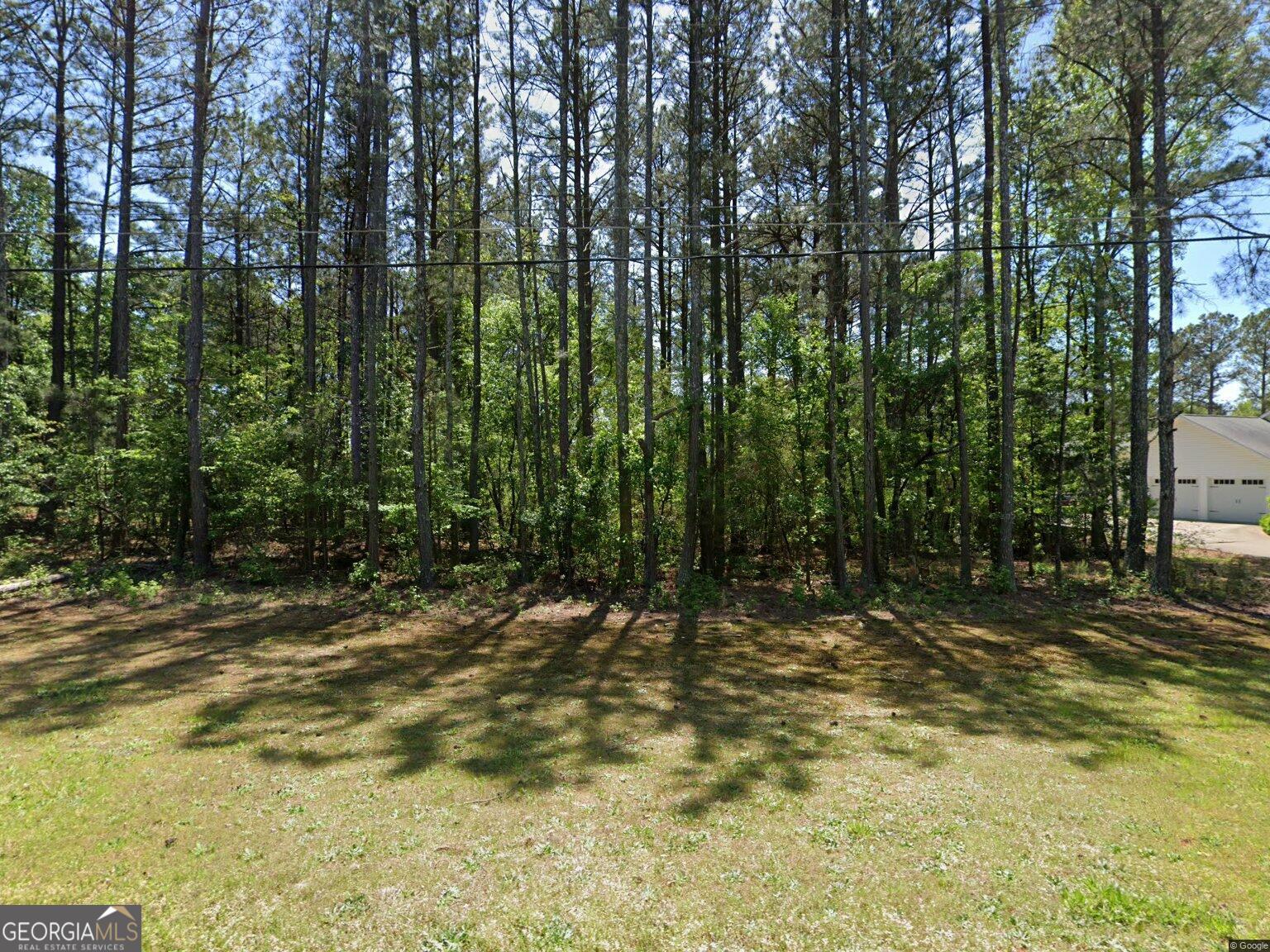 Build your dream home on this serene 0.53-acre lot within the prestigious St. Andrews Country Club Estates in Winston, GA. Nestled in Douglas County, this tranquil parcel offers both seclusion and convenience, with public utilities already available to help streamline your construction process. Situated on a spacious, level lot with mature trees and residential charm, this property provides flexibility for custom design choices-whether envisioning a cozy family home or an elegant estate complete with outdoor living spaces. Its substantial size gives you the freedom to lay out your perfect layout while maintaining privacy from neighboring homes. This lot represents a rare opportunity in a well-established community. Don't miss your chance to secure one of the few remaining build-ready sites in this sought-after locale.