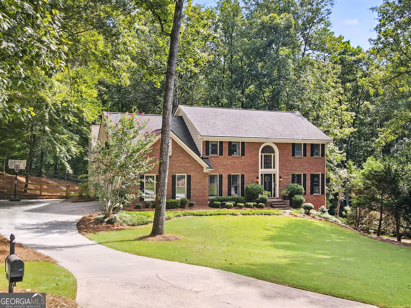 WELCOME HOME! You will love this move-in ready 5 bed, 4 bath, brick-front beauty in highly sought-after Country Club of Roswell - Willow Springs! The spacious main living level boasts a grand two-story foyer with curved stair detail, beautiful hardwood floors, and includes a formal living room- perfect for a home office or flex space, formal dining room, convenient guest bedroom and full bathroom, vaulted fireside family room with custom built-ins, wet bar, and 2nd staircase, and a heart-of-the-home kitchen, complete with stone countertops, breakfast bar, beautiful old-world style stone arch cooktop area, and adjacent breakfast area with extra storage that leads out to a cozy screened in porch overlooking the backyard! Upstairs, you'll find thee sizable guest bedrooms, guest bathroom, and the oversized primary bedroom with enormous ensuite bath featuring a double vanity, soaking tub, large walk-in shower, and walk-in closet. The walk-out daylight terrace level includes a large finished multi-purpose space, full bathroom, and loads of unfinished storage space! Outside, you'll find plenty of opportunity for entertaining, play, or just relaxing with a screened porch and oversized deck off of the main level, covered patio below, and green space with low-maintenance artificial turf and room for even more in the fenced-in backyard! The Country Club of Roswell (membership not included) offers tons of fabulous amenities such as a pool, golf course, tennis courts, workout facilities, bar, wine club/dinners, full dining service, and much more! Very active HOA with loads of family activities, concerts/movies at the park and more throughout the year! DON'T WAIT, be sure to schedule your showings ASAP!