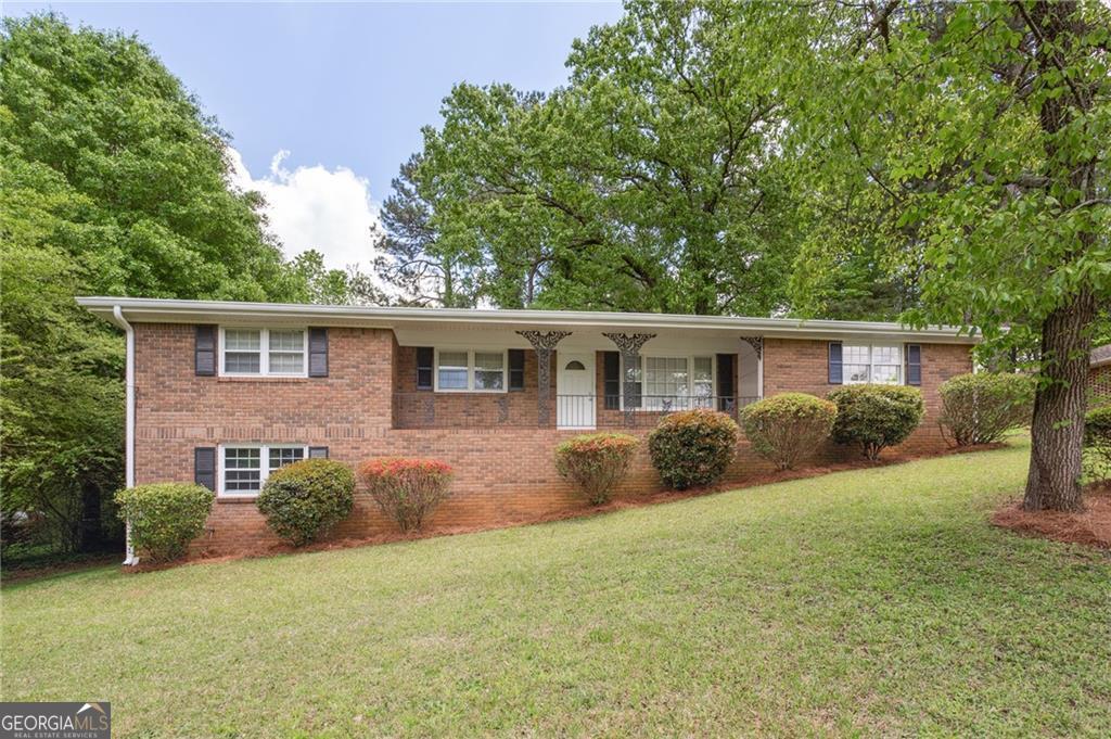 Coming Soon! Say hello to your future home at 6243 David Lane-a 4-sided brick beauty in the heart of Mableton! This gem offers 3 bedrooms, 2 baths, a separate dining room perfect for hosting those fancy dinner parties (or just pretending you're fancy), and a cozy living room ideal for binge-watching your favorite shows guilt-free. The fully finished basement includes two bonus rooms-great for a home office, gym, game room, or your personal "please don't bother me" zone. Fresh new paint and flooring throughout mean you get that satisfying "new home" feel without the hassle. The updated kitchen shines with sparkling quartz countertops and brand-new stainless steel appliances-because your cooking deserves a little glam. Enjoy year-round comfort with a new HVAC system and peace of mind from a recently serviced septic tank (yes, we said septic, but don't worry-it's been cleaned and is happy). The side-entry basement garage is perfect for DIY projects or skillfully hiding all those "surprise" deliveries that magically appear on your doorstep. An attached 2-car carport and plenty of extra storage round out this no-HOA beauty in the well-established James Acres Estates community. Bonus: Easy access to I-20 and I-285 means less time in traffic, more time enjoying your new digs. Stay tuned-this one's coming in hot!