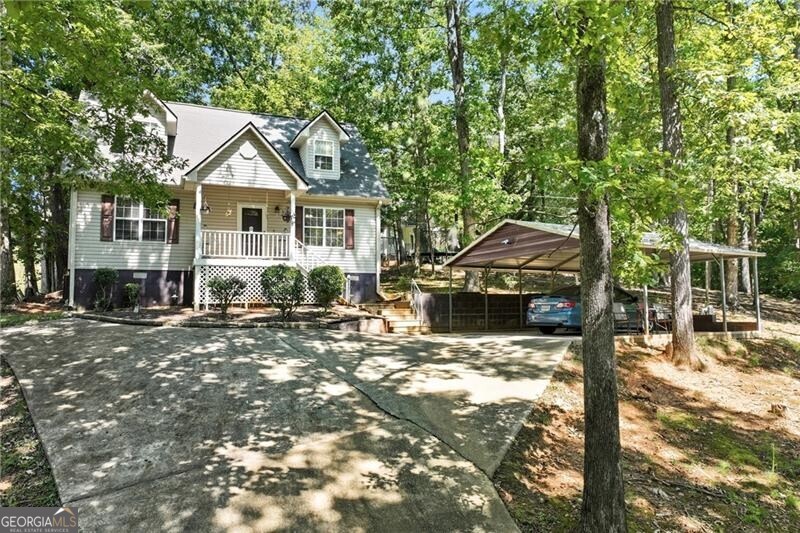Charming cape cod cottage on over an acre; Flat back yard with an outbuilding for storage. Well kept and maintained - Roof is just 2 years old, the HVAC 7 years old, one year old water heater and the septic was just serviced two years ago. Close to shopping, restaurants and hospital. This would be a great full time home or as an investment for short term rental as it's super close to Lake Lanier, downtown Gainesville and Lake Lanier Olympic Park.