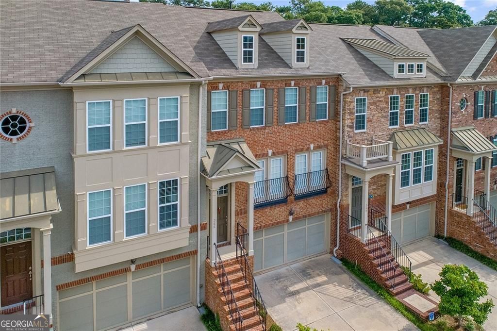This spacious Buckhead townhouse is located in the heart of it all! Home ideally located in south Buckhead/north midtown, walking to your favorite restaurants and shops, minutes to beltline. Upon entering home, you are greeted by views into the expansive living room and breakfast nook, which flow into the open kitchen with island, making it perfect for entertaining. Upstairs, the master bedroom features an oversized walk-in closet and large bathroom with soaking tub, laundry room on the hallway, and a second bedroom with full bath. Terrace level featuring an additional bedroom and full bathroom just off the garage. Back yard/deck opens/overlooks to the large community courtyard with outdoor fireplace. You don't want to let this home pass you by!