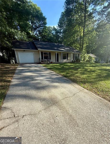 Looking for a Beautiful and affordable Home? look no further , you have have found it! As soon as you step inside you are greeted with large family room , nice brand new hard floors, the cozy fireplace, new paint , Nice kitchen with granite countertop , eat in breakfast area . The house has been remodeled to provide comfort and convenience for the new owners. Also the great spacious back yard is perfect for family reunions . Great location in Marietta area. Very quiet neighborhood .