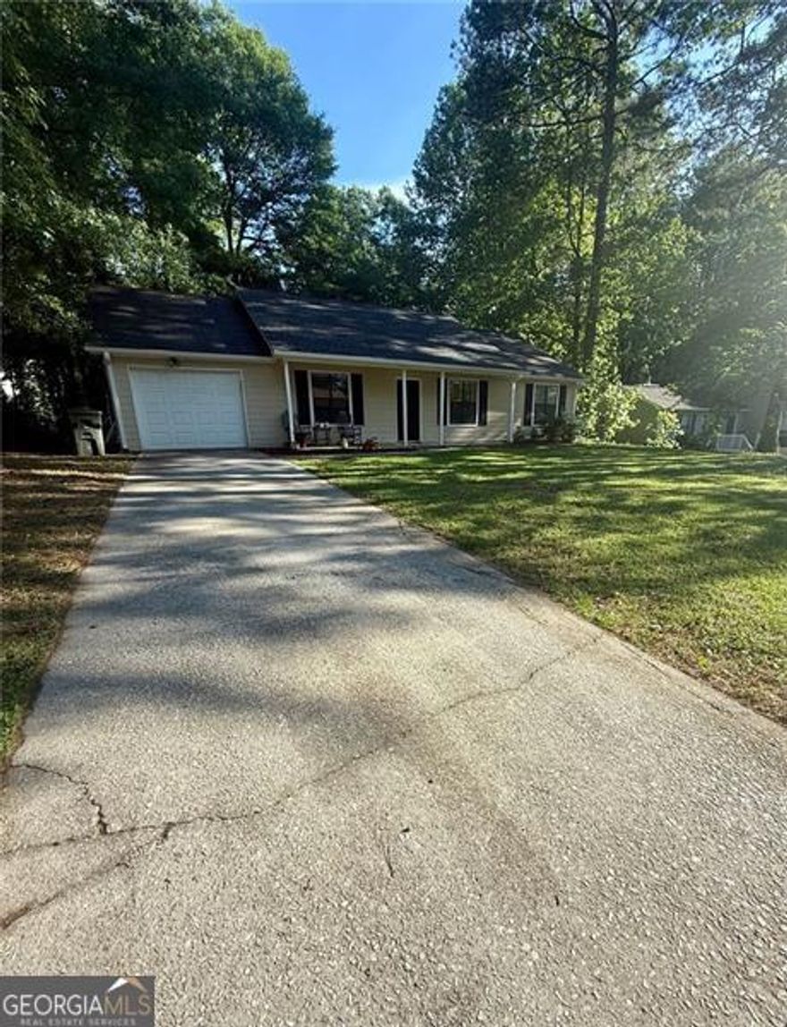 Looking for a  Beautiful and affordable Home? look no further , you have have found it!  As soon as you step inside you are greeted with large family room , nice brand new hard floors, the cozy fireplace, new paint , Nice kitchen with granite countertop  , eat in breakfast area . The house has been remodeled to provide comfort and convenience for the new owners. Also the great spacious back yard is perfect for family reunions . Great location in Marietta area. Very quiet neighborhood .