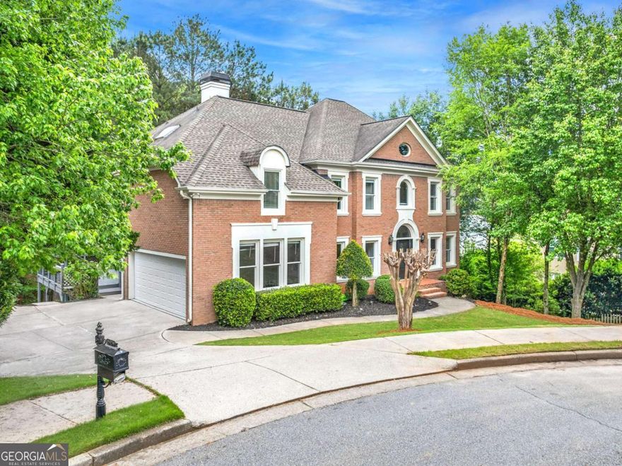 Wow! Don't miss this stately 6 bed, 5 bath, 4-sided brick, move-in ready traditional home with loads of natural daylight, guest suite on the main level, updates throughout, full finished daylight terrace level and more, all situated on a quiet cul-de-sac in the highly sought-after Alpharetta/Johns Creek swim/tennis community of Chartwell! The spacious main living level offers a formal living room, formal dining room, large guest bedroom, updated full bathroom, laundry room with utility sink, and the fabulous updated kitchen complete with quartz countertops, stainless appliances, double oven, pantry, and adjacent breakfast area open to the striking vaulted fireside family room, all overlooking the peaceful, private tree-lined backyard! Upstairs, you'll find three spacious guest bedrooms, two guest bathrooms, and the oversized retreat-like primary suite with trey ceiling detail, fireplace, and the renovated spa-like ensuite bath featuring a double vanity, walk-in shower, and separate centerpiece soaking tub! The full, finished daylight walk-out terrace level includes an additional family room, media room, bonus space, guest bedroom, and full guest bathroom! This home offers plenty of opportunity for outdoor entertaining with an expansive, low-maintenance Trex deck on the main living level, and a green space for additional activities! Driveway parking pad provides space for multiple cars or basketball play. Chartwell community includes pool, tennis courts, clubhouse, playground, and a community lake, and is located just steps to Newtown Park, shopping, restaurants, and more! Easy access to GA 400! DON'T WAIT, be sure to schedule your showings ASAP!