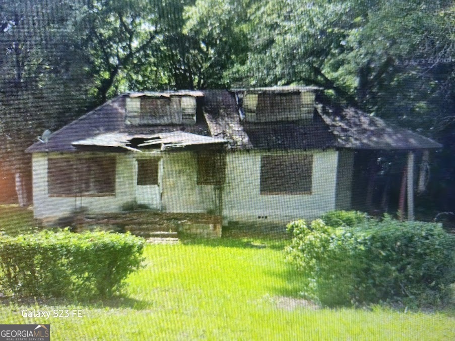 Handy man Special or Investors. Property Sold (AS IS). Corner lot, conveniently locate across from State of Ga Dept of Correction College. Great opportunity to create rental property or build a home . Convenient to I:75 and Downtown and businesses. This area has construction and redevelopment of Properties being built in the area. Seller is open to all Offers. Making this a great opportunity for investors and home builders.
