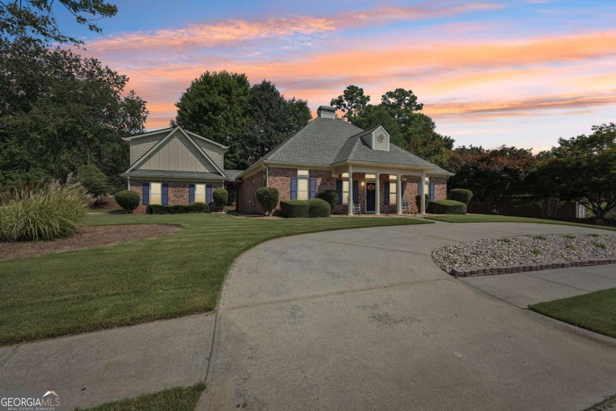 Rare, 4-sided brick ranch home in sought after Bridgemill S/D! Great corner lot with side driveway, and circular front driveway. Walk inside to a move in ready, one, level ranch featuring a very functional floorplan, tons of daylight, and 3 bedrooms on main level. Split bedroom plan with master on one side, and additional bedrooms on the other. Two living spaces to allow for multiple gathering spots. Detached garage has a fully permitted addition that could be an income producing unit, teen or in-law suite. Currently used for a professional studio and has appropriate sound proofing for this purpose. Just minutes to 575, Lake Allatoona and both Downtown Woodstock & Canton! Check out Bridgemill's Clubhouse & Restaurant! Bridgemill offers many additional Optional amenities including 18-hole golf course, hard-court & clay tennis court, pickle ball, volleyball, basketball courts, playground/pavilion, a 2-acre pool with snack bar & fitness center. These are Optional amenities that you can join!
