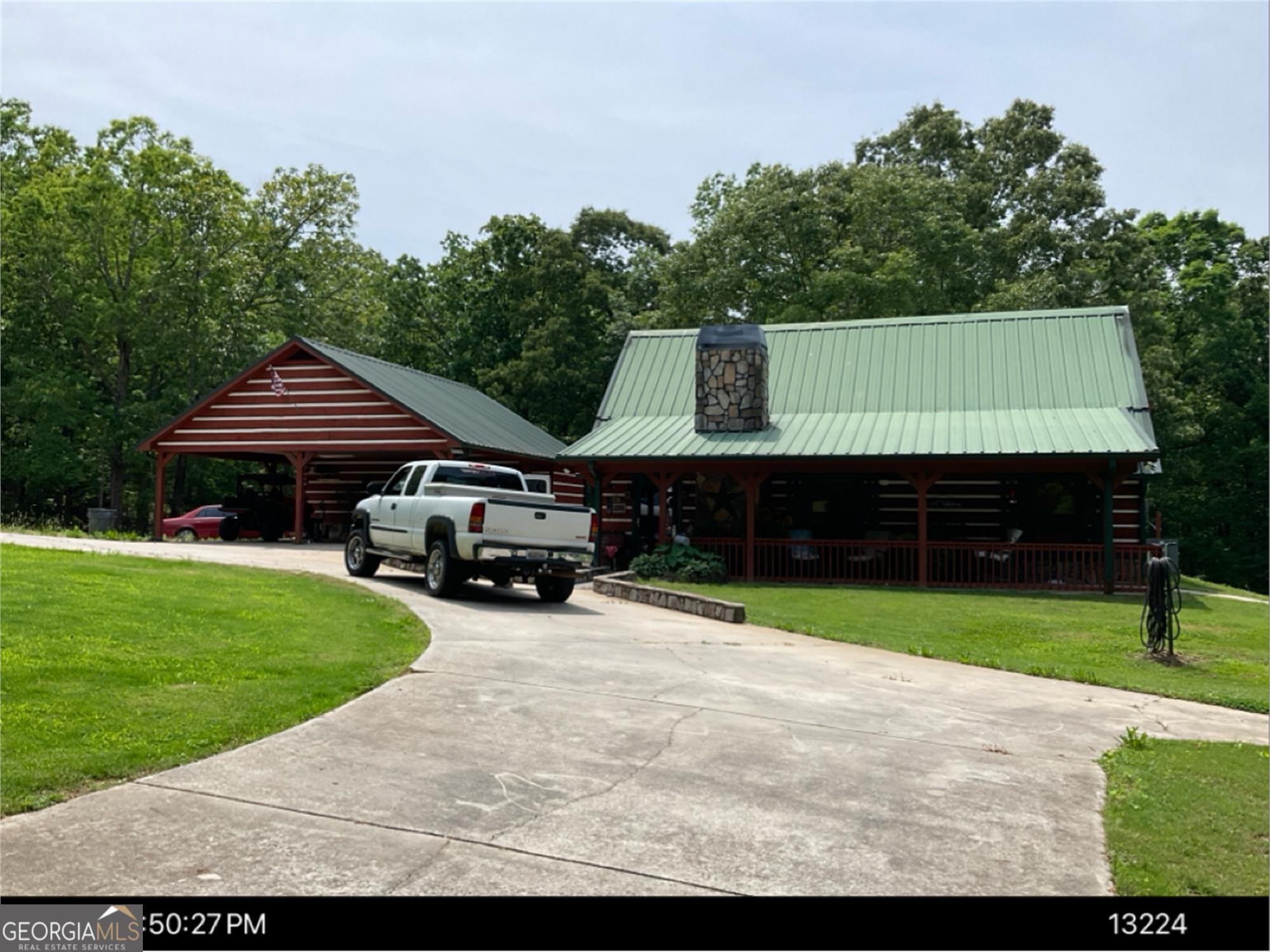 Welcome to your own country paradise! This stunning 49.75-acre property offers a charming log cabin, a carport/ office, an in-ground saltwater pool, a pool house, an outdoor cooking shed, and a spacious 22x40 triple garage bay/ workshop. The land features mostly mature hardwoods with some pasture, providing the perfect setting for outdoor adventures. Enjoy the outdoors right on your property, or explore the ample space for ATVs, dirt bikes, and 4-wheelers. Create your own trails or ride along the existing ones. The cozy home has all the looks of a real log cabin, but is not built with real logs! This makes for simpler construction, better insulation and easier maintenance. The home boasts 2 bedrooms on the main floor and an additional bedroom adjacent to a loft area. The open kitchen flows seamlessly into the living room, complete with stone trim around the bar. The living room is highlighted by high vaulted ceilings with beautiful beams, a stone fireplace, and a striking stone archway that leads to the hallway and bedrooms. The master bath offers a whirlpool tub, separate shower, and laundry connection, while the large mudroom provides a perfect entrance after a day of outdoor activities. Along side of the in-ground saltwater pool is a unique matched pool house with a kitchenette. The adjacent carport has an attached office, offering flexibility for your needs. This property is not only ideal for personal recreation but also presents a great opportunity as a family compound or potential lot development. DonCOt miss the chance to see it for yourselfCocall today for a showing! Agents/ Buyers please see private comments for showing information. There is NO real estate yard sign per the owners request.