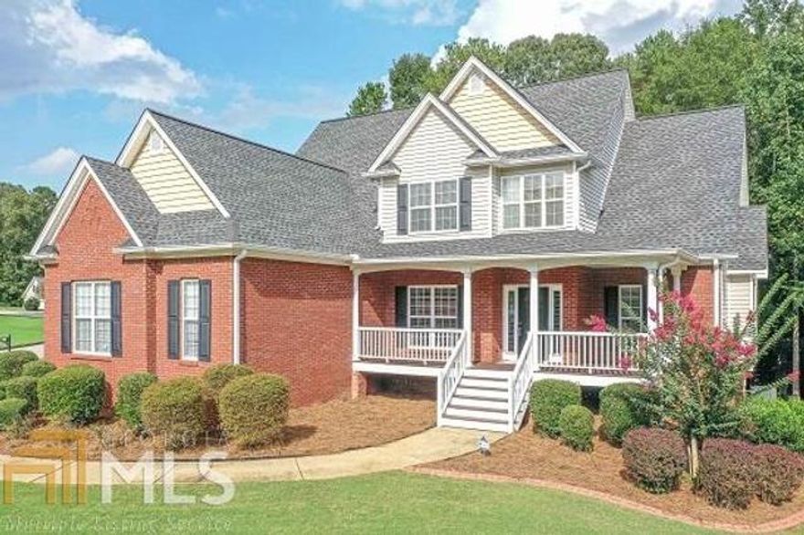 This immaculate move in ready home in Evanleigh Woods features 6 bedrooms and 4 full bathrooms, a private lot, and a rocking chair front porch! The updated kitchen boasts granite countertops, tile back splash, center island, breakfast bar, breakfast area, tile floor & stainless steel appliances. Spacious master on main has tray ceilings, double vanity, garden tub, tile shower, & walk-in closet. In addition to the 3 bedrooms & 2 bathrooms upstairs, there is also a second living area for kids to watch tv or play video games, & a bonus room that can be used as an office, media room, playroom, or even a 7th bedroom! The basement has a bedroom, tons of storage space, & a separate garage door that is perfect for storing your boat! Roof was replaced in 2017, hardwood floors refinished in 2019, and both include transferable warranty. Fresh paint and brand new carpet! Beautifully landscaped with irrigation system. No HOA fees.
