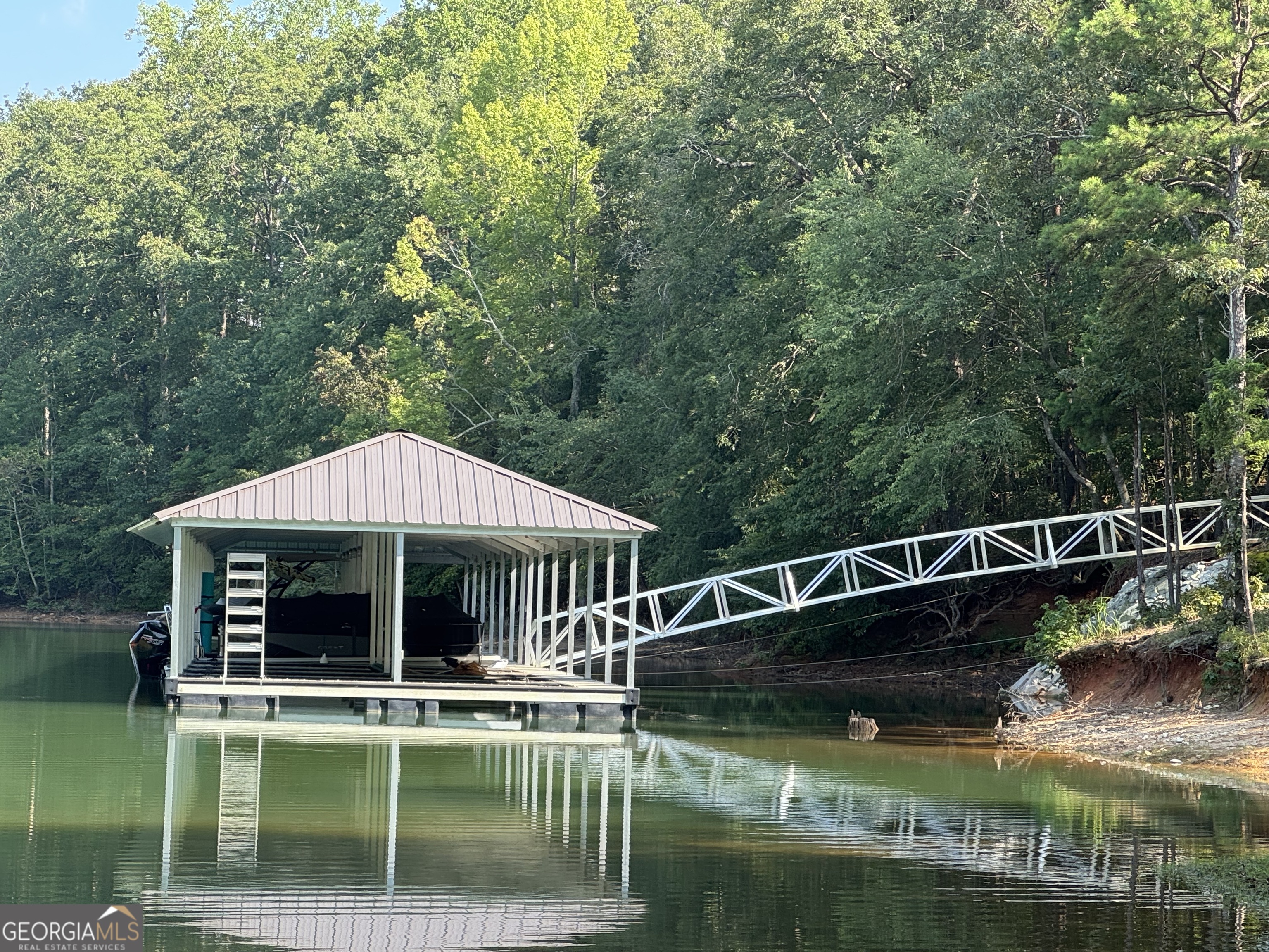 Waterfront lot on Lake Hartwell at affordable price! Enjoy lakefront access in the community Lake Falls of Lake Hartwell. Lot is adjacent to corp land with lake access and golf cart ride to Community dock. Lot comes with a slip in the dock. Lot is approved for septic system.