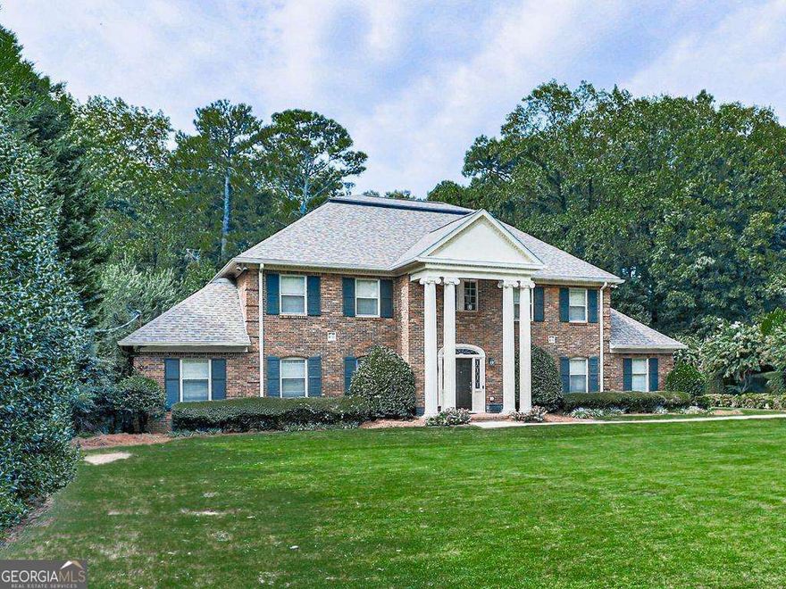 Do not miss this executive masterpiece in gorgeous Terrell Mill Estates. Classic, traditional styling and rock-solid construction of 4-sides brick and steel beams. Sprawling floorplan with plenty of room to spread out on 3 finished levels. Each of the 5 bedrooms has an ensuite bath and walk-in closet. Stylish traditional floorplan features a grand 2-story Foyer with curved staircase, formal Living and Dining Rooms, island Kitchen that is open to the large Den and a great Sunroom that overlooks the private backyard and pool. The main level also features a private guest bedroom with full bath, Powder Room, and office that looks out to the front yard. The upper-level features 4 large bedrooms, each with ensuite bathroom. The enormous owner suite has his and her bathrooms! Fun terrace level for entertaining features a billiards room, full bath, bar and Kitchenette, Media Room, and storage room. There is a rear entry garage on the terrace level for outdoor toys or tools. Beautiful 20 x 40 inground pool and gazebo to enjoy the private 1.18-acre lot. All rooms are very large and really give the feel of having a lot of room to spread out and many options for furniture placement. Quality 4-sided brick construction with steel beams in basement, hardwood floors, insulated windows, extra insulation and radiant barrier in attic and much more. Unbeatable location just minutes to Truist Park, Interstates 75 and 285 and all major travel routes and a myriad of shopping and dining choices, golf, hiking, kayaking, and much more. Also, at the end of the street there is access to the Cochran Shoals Unit of Chattahoochee River Recreation Area and nearly 1000-acres of hills and forest to explore and miles of hiking trails and 7-miles of mountain bike trails! The right updates and decorator touches will make this a showplace to enjoy for generations!