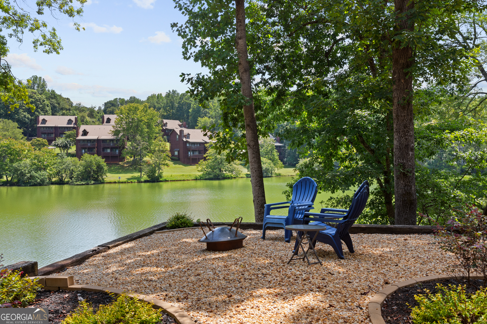 Located in the mountains of North Georgia, Mountain Lakes Resort is a gated RV and cabin community on the edge of the Chattahoochee National Forest. This private lake community offers a 50-acre stocked lake, fishing boats, paddle boats, a furnished clubhouse with gym, sauna, steam room, hot tub, dining, two outdoor pools, one indoor pool, waterslide, stables, horseback riding, hiking trails to a waterfall, putt-putt golf, playgrounds, seasonal events, community docks, paved roads, and 24-hour security. This property includes one deeded lot with year-round water views. Vacant lakefront lots in Mountain Lakes are rare, especially those with a grandfathered dock-one of which sits directly in front of the property. It's just a short walk to the water for fishing or kayaking. The resort is near Cleveland, GA, and the alpine-style town of Helen, GA, known for its local wineries, dining, waterfalls, and outdoor activities.