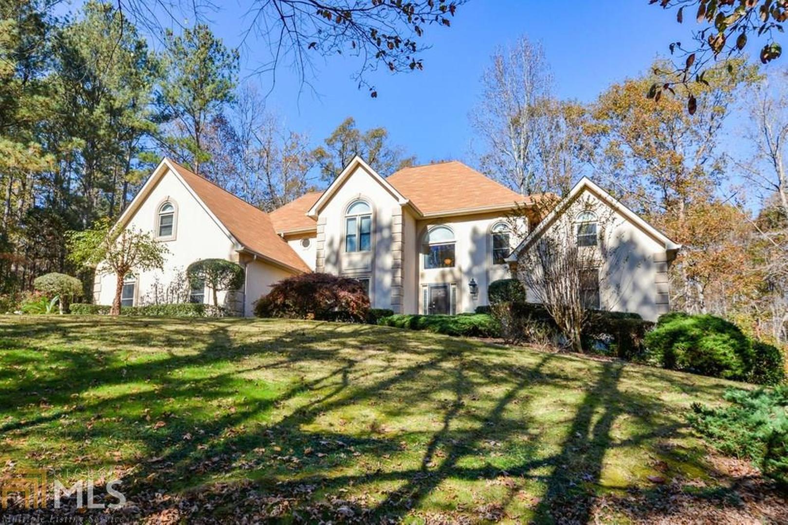 5 Acres of privacy await you in this meticulously maintained home. All you need to do is move in and enjoy. You will love this oversized 2 car garage that will accommodate almost any vehicle with room to spare, then step right into the kitchen. You won't believe the size of this laundry room. There is room for a freezer and sewing or folding table as well. Relax on the screened porch overlooking your private wooded backyard while enjoying all nature has to offer right in your backyard. You will actually enjoy cooking in this well appointed kitchen with a huge walk in pantry and granite counter tops. The master on the main gives you much needed privacy from your guests or the children on their own upper level with 2 spacious bedrooms 1 with a balcony, a full bath and oversized bonus, office or media room over the garage. The basement is unfinished for future expansion including a workshop, boat door with driveway. Home is connected to public water and has a well and home is total electric with an LP tank for gas logs in fireplace if power goes out, you still stay warm. There are so many possibilities here and all of this without an HOA. See it today and fall in love immediately.