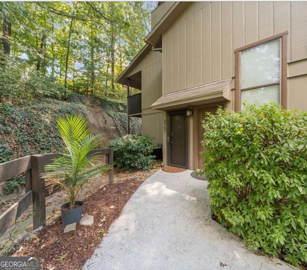 Welcome Home to Comfort, Convenience & Charm in the Heart of Smyrna! Step into this inviting 1-bedroom, 1-bath main-level gem, perfectly positioned in one of Smyrna's most vibrant and accessible neighborhoods. Just minutes from Truist Park, Vinings Jubilee, the Home Depot Headquarters, and the scenic beauty of the Chattahoochee River National Recreation Area and Silver Comet Trail, this home offers a lifestyle as exciting as its location. Inside, the spacious living room welcomes you with elegant custom built-ins and a warm, wood-burning fireplace-perfect for cozy evenings in. The thoughtfully designed kitchen features plenty of storage and counter space, ideal for both everyday living and entertaining. Step out onto your private covered patio to unwind with your morning coffee or enjoy a serene evening retreat. This smart home is equipped with a smart thermostat and smart door lock, allowing you to control your comfort and security with ease-whether you're at home or on the go. The community itself boasts top-notch amenities, including a sparkling swimming pool and tennis courts, and with fast, convenient access to I-75 and I-285, you're never far from everything Atlanta has to offer. Whether you're a first-time buyer, savvy investor, or simply looking to downsize without compromise, this home delivers low-maintenance, high-comfort living in a truly unbeatable location. Schedule your private showing today and discover your perfect blend of modern living and Southern charm!