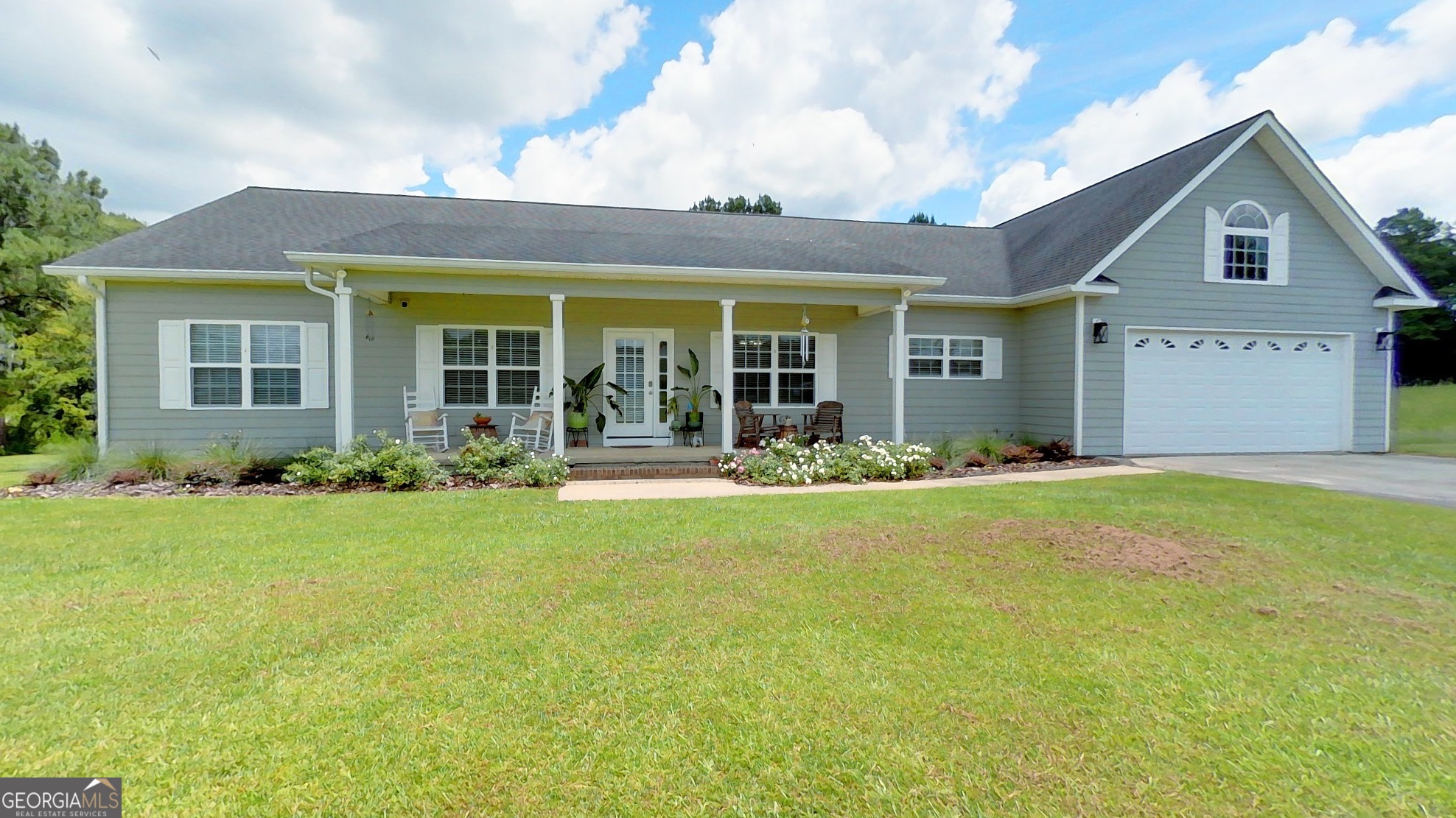 *****PRICE REFRESH***** From the outside, you might think this home is cozy and compact - step inside and prepare to be amazed. This gorgeous home is very spacious with a smart layout and a warmth that photos just can't capture. This beautifully designed 2,566 square foot home, set on 4.67 acres offering a perfect blend of comfort and space. High ceilings and large windows fill the home with natural light complimenting the hardwood floors throughout the main living area. The kitchen features tile flooring and equipped with stainless steel dishwasher, oven, and refrigerator-purchased in 2023. The home boasts four generously sized bedrooms, three of them with full ensuite baths for added comfort, while a convenient half bath is available for guests. The expansive primary bathroom offers a double vanity, soaking tub, and an exceptionally large walk in closet. Storage will not be a problem in this home. The open layout and spacious living areas create a welcoming atmosphere, while the outdoor space offers ample room to enjoy nature. Experience peaceful living with modern conveniences in this well-appointed home.