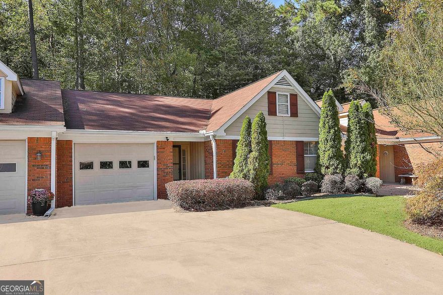 RELAX AND ENJOY A CAREFREE LIFESTYLE IN POPULAR DOVER SQUARE, A QUAINT SIDEWALK COMMUNITY PERFECTLY LOCATED IN THE HEART OF PEACHTREE CITY! Situated on one of the most desirable greenbelt lots in Dover Square, this home is absolutely pristine and ready for the lucky new owners! The open flowing plan features stunning vaulted ceilings, decorator neutral decor, brick fireplace, built-in bookcases, and durable hardwood style flooring! You will love having two living areas...vaulted great room plus gorgeous sunroom addition, both overlooking a lush "backyard oasis" surrounded by nature and delightful flowering "English gardens!" Remodeled kitchen equipped with granite counters, tile backsplash, and upscale stainless appliances including refrigerator! Owner's retreat is enhanced by a spa bath complete with dual sinks, jetted tub, and separate tile shower. Spacious guest suite with two closets and adjoining bath with granite vanity makes it perfect for visitors! Nothing left to do but move-in and relax....the owners even leaving a top-quality LG washer and dryer too! The HOA takes care of yard maintenance, pine straw and termite bond! Convenient location close to everything... CONNECTED TO 100 MILES OF CART PATHS WITH QUICK ACCESS TO SHOPPING, RESTAURANTS, AND I-85! WOW!