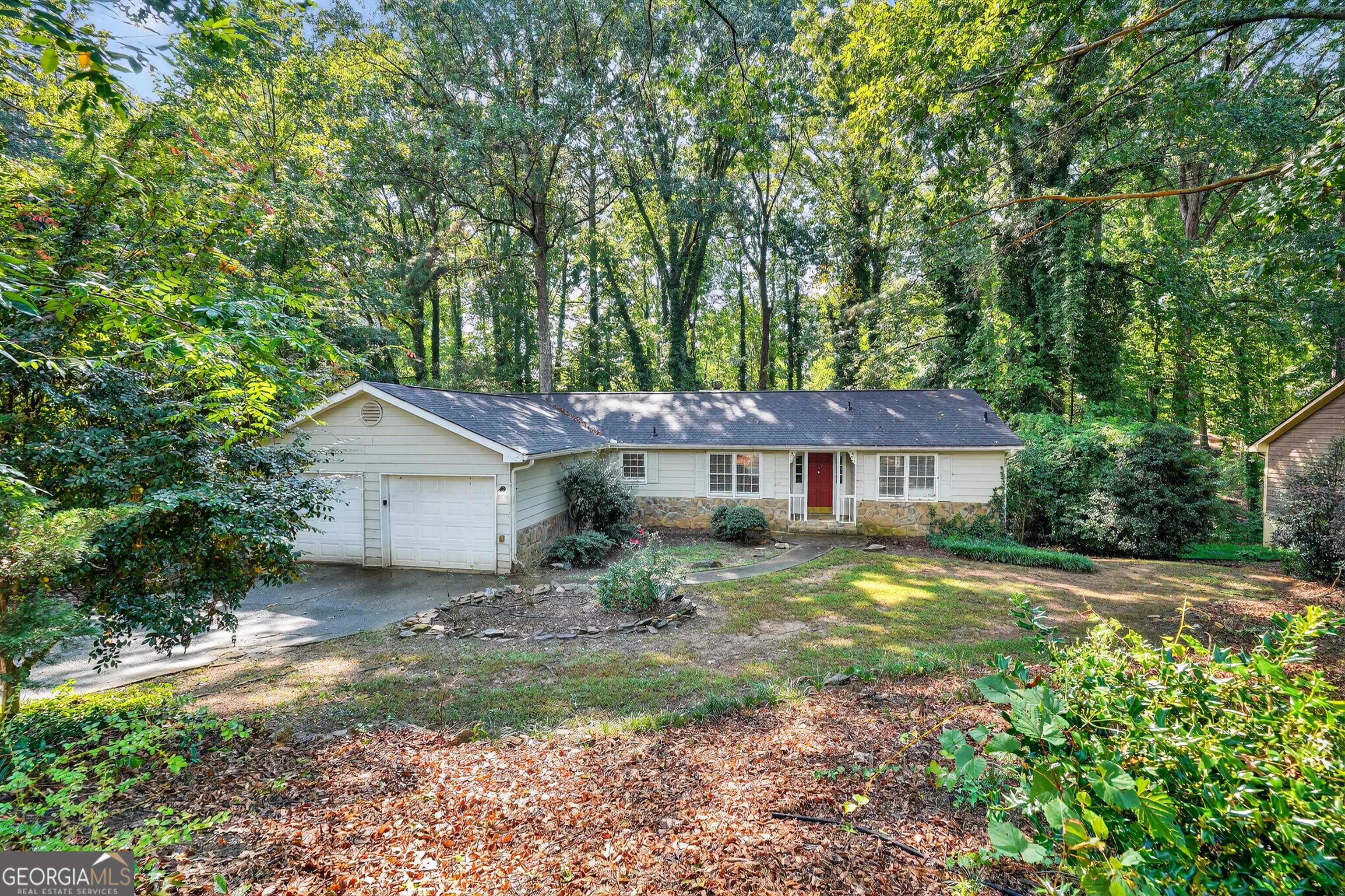 Welcome to 5040 Waterford Dr SW in Mableton, GA! This charming single-level home features 3 bedrooms and 2 bathrooms with a spacious layout perfect for comfortable living. The inviting living room boasts a cozy fireplace and vaulted ceilings, creating a warm and open atmosphere. The kitchen offers stainless steel appliances, ample storage, and plenty of counter space for cooking and entertaining. Step outside to the back deck, ideal for relaxing or hosting gatherings. Additional highlights include a 2-car garage and an unfinished basement ready for your personal touch and customization to fit your needs. Don't miss the chance to make this lovely home yours!