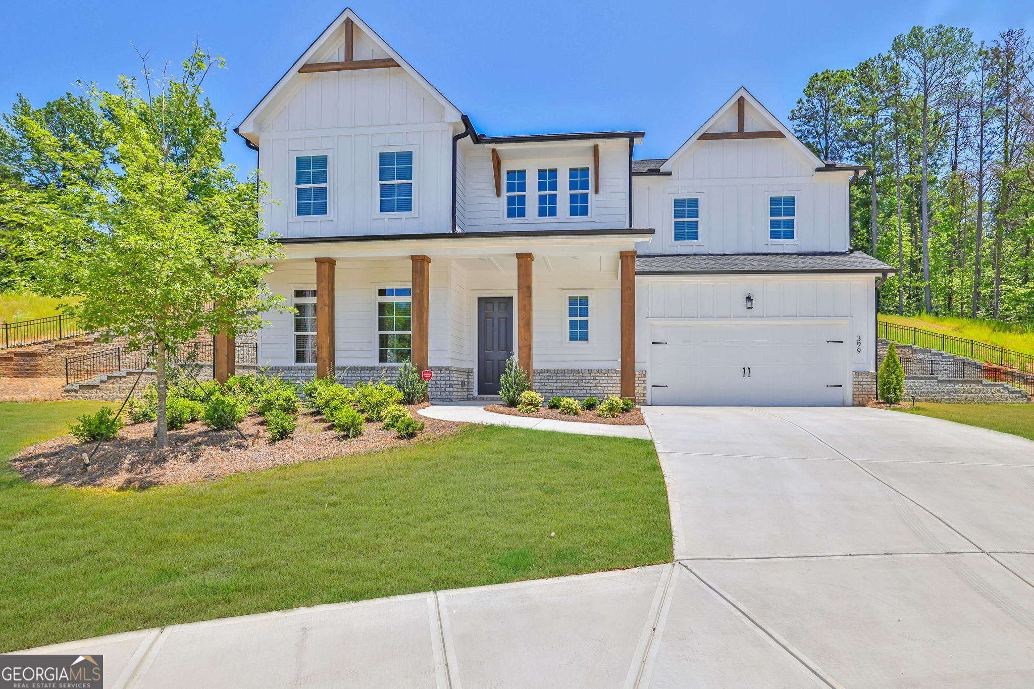 Welcome to your like new dream home perfectly situated between Woodstock & Milton! This stunning residence is nestled on a peaceful cul-de-sac with a rare & private backyard lot! It offers the perfect blend of exceptional craftsmanship, modern living, resort style amenities, & a prime location. The highly sought after neighborhood of Easley is completely sold out, but you can still take pleasure in the benefits of having a practically brand-new home without enduring a wait. Once you enter your grand 2-story foyer youCOll fall in love with the huge open concept design. The flow from the dinning, family, & kitchen areas are ideal for relaxing together or entertaining. The gourmet kitchen features an oversized island, butler area with an enormous walk in pantry, & upgraded stainless steel appliances including a 5 burner gas stovetop. You can continue the enjoyment heading outdoors right off the kitchen & onto your covered patio that provides complete privacy. Back inside you have a bedroom, full bath, & powder bath on the main for an in-law suite or flex space. All adorned with upgraded hardwood floors thru out the whole 1st floor & even on the stairs. Upstairs the immense space continues with the large loft space, generous laundry room, the oversized owner suite, it's luxurious bathroom, & a giant walk-in closet! Plus 3 more bedrooms & 2 more baths. This is your ideal home & neighborhood with sidewalks, a community pool, grilling stations, & a dog area to utilize. All under 5 miles from the vibrant downtown with shops, restaurants, parks, and top-rated schools. This is the one that has it all along with a transferable structural warranty to add peace of mind for years to come!