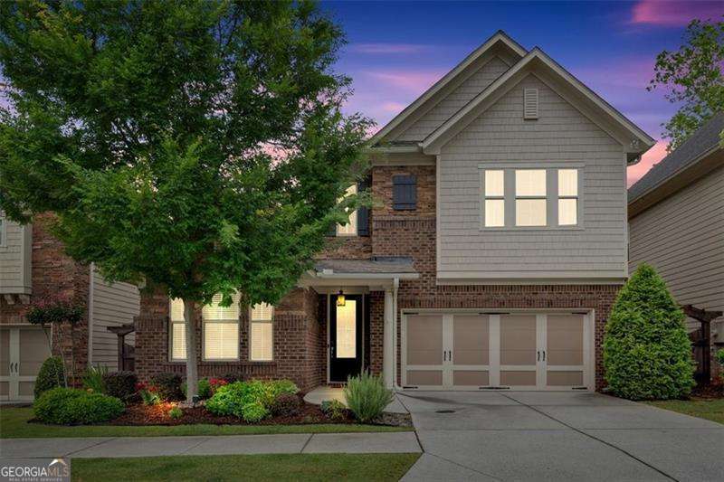 MOVE-IN READY... Freshly painted with new carpet! Located just a short walk to Roswell Town Square, local coffee shops, and excellent restaurants, you are sure to love this exceptional home in the heart of Roswell. As you enter this open floor plan, you will find a family room with a gas fireplace and custom-built bookshelves that flow seamlessly into a spacious kitchen featuring 42" cabinets, a stainless-steel gas cooktop, double ovens, a charming farmhouse sink, and a large island perfect for entertaining. A walk-in pantry adds extra convenience. There's a full bedroom and bathroom on the main level, ideal for guests, a home office, or a playroom. Upstairs, you'll love the primary suite, which offers a well-appointed space featuring hardwood floors, a spa-like bathroom, and an oversized walk-in closet with built-in shelves and ample storage. There's also a loft area that provides additional space for a game room, lounge, or creative area, along with two more bedrooms featuring brand-new carpet and a shared hall bath. In the garage, you'll find an EV charger and plenty of room for storage. Good news-the HOA covers lawn care and irrigation for the entire community. You're sure to love this friendly, social community where neighbors know each other's names and friendships come easily. Call today to schedule an easy appointment!