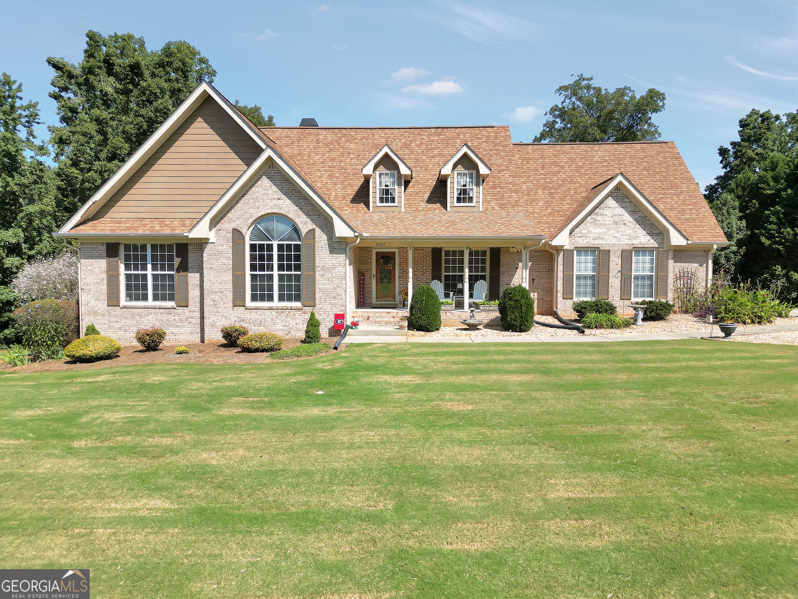 Welcome to this beautifully maintained home in the highly sought-after Ola School District. Built in 2002, the home features a classic brick front with durable HardiePlank siding, offering both charm and lasting quality. Inside, you'll find three bedrooms and two full baths on the main level, along with a spacious family room highlighted by soaring ceilings that create an open, inviting feel. The finished daylight basement adds valuable living space with a convenient kitchenette and full bath, making it perfect for guests, in-laws, or entertaining. Outdoors, the backyard is designed for relaxation and fun, with an above-ground pool bordered by an attractive deck, plus direct access to a peaceful pond that is shared by only a few neighboring homes. A stationary dock extends the space for fishing, kayaking, or simply enjoying the quiet water views. Set on a full acre in a quiet neighborhood, this move-in-ready property offers the best of comfort, space, and lifestyle in one of the most desirable school districts in the area.