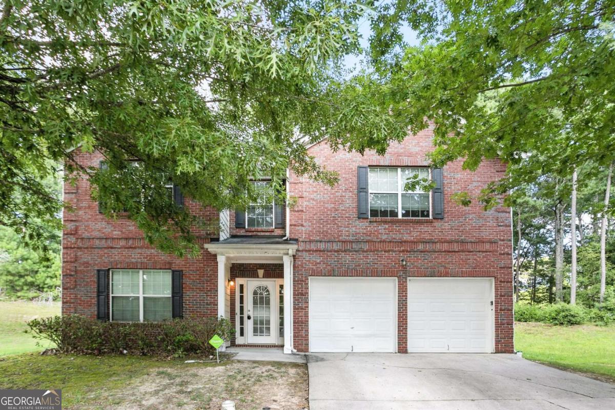 Tucked in a quiet cul-de-sac in the Poplar Falls neighborhood, this two-story home offers a smart layout with all three bedrooms upstairs and plenty of room on the main floor to entertain or relax. The living room features a fireplace and flows into an eat-in kitchen with a view to the family room. A separate dining room gives you extra flexibility for hosting. The primary suite includes a soaking tub, separate shower, and walk-in closet. Outside, enjoy a flat backyard and attached two-car garage. Located minutes from shopping, schools, and I-20 access.
