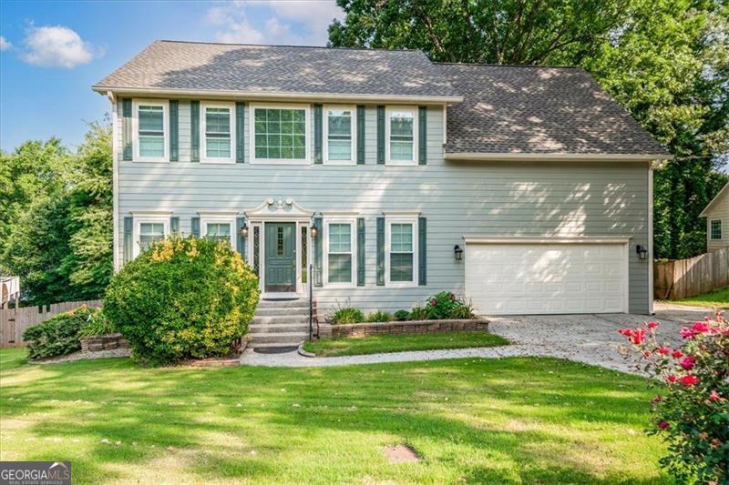 Completely rebuilt in 2022 after a lightning strike, this home offers the rare opportunity to own a nearly brand-new home in an established neighborhood. With new Champion windows, Hardiplank siding, a new roof under warranty, and updated systems including two new HVACs, a furnace, and water heater ~ every major component was thoughtfully replaced. Do not miss out on spending time in this new luxurious spa bathroom for the most discerning buyer. Inside, you'll find fresh carpet, new flooring, updated steps, a beautifully finished basement, new appliances, and not one, but two spacious primary suites upstairs. Located in the desirable 30043 ZIP code, this home is part of a friendly community close to parks like Collins Hill, Sweet Water, and Tribble Mill, and minutes from vibrant downtown Lawrenceville with its local shops, dining, and the renowned Aurora Theatre. You'll also enjoy proximity to Sugarloaf Mills, major highways, and family-friendly attractions like Medieval Times and the Gwinnett Stripers stadium. Zoned for top-rated Gwinnett County schools, such as, Rock Springs Elementary, Creekland Middle, and Collins Hill High, this home is a combination of modern comfort, convenience, and quality in one package! Don't miss your chance to experience the best of Lawrenceville living in a home that feels brand new.