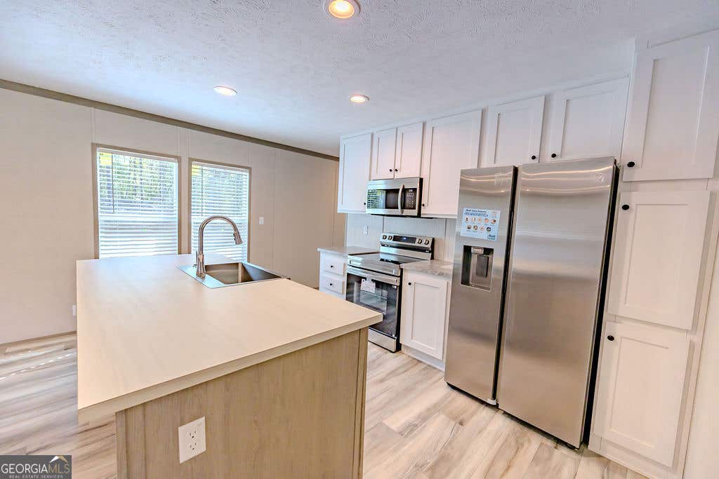 Photo of 944 Collins Lane, Rentz, GA 31075 (MLS # 10827069)