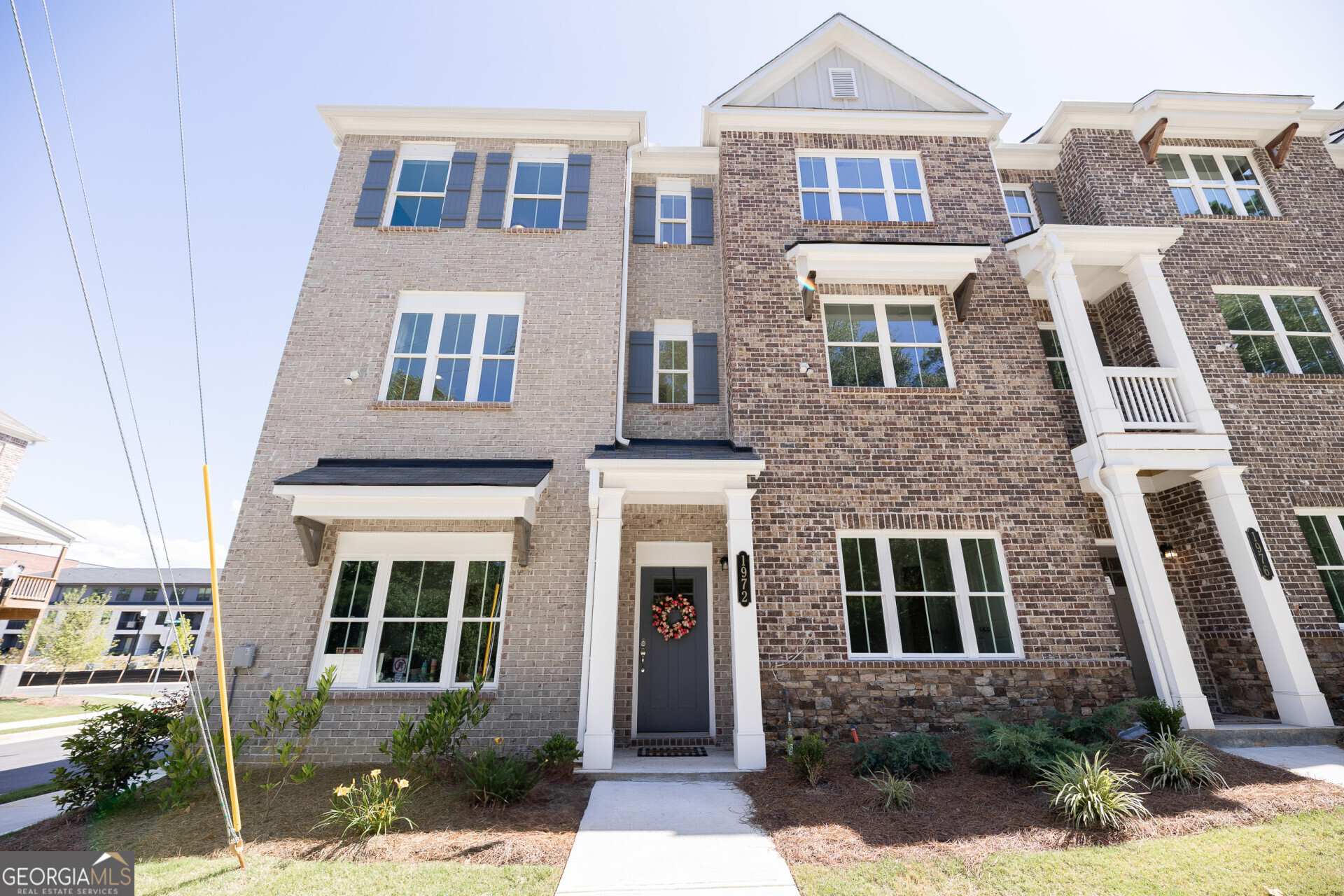 This stunning townhouse located at 1972 Deco Dr in Kennesaw, Georgia, is a modern masterpiece that was built in 2024. Boasting a sleek and stylish design, this property offers a luxurious and comfortable living space for its future residents. With a total of three bedrooms and three and a half bathrooms, this townhouse is perfect for families or individuals looking for a spacious and elegant home. The interior of the property spans over 2,034 square feet of finished area, providing ample room for both relaxation and entertainment. The open-concept floor plan creates a seamless flow between the living, dining, and kitchen areas, making it perfect for gatherings and socializing. The kitchen is equipped with high-end appliances, custom cabinetry, and quartz countertops, making it a chef's dream. The townhouse features three stories, allowing for privacy and separation between the bedrooms and living spaces. The bedrooms are generously sized and offer plenty of natural light, creating a warm and inviting atmosphere. The master suite is a true oasis, complete with a spa-like ensuite bathroom and a walk-in closet. Outside, the property sits on a lot size of 1,350.36 square feet, providing a low-maintenance outdoor space for residents to enjoy. The townhouse also features a private patio or deck, perfect for enjoying the beautiful Georgia weather. Additionally, the property comes with a two-car garage, providing ample parking and storage space for residents. Located in the heart of Kennesaw, this townhouse offers convenient access to shopping, dining, entertainment, and major highways. With its modern design, high-end finishes, and prime location, this property is truly a rare find. Don't miss the opportunity to make this townhouse your dream home!