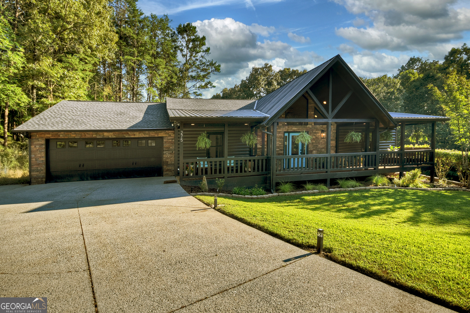 Sophistication meets Serenity for ideal mountain living! This stunning modern rustic retreat offers the pinnacle of upscale living. Thoughtfully designed to blend natural textures with contemporary elegance. Panoramic mtn. views, upscale finishes & cozy mtn charm converge in perfect harmony. Featuring a total of 4BR's (2 BR's on main level &2 BR's on terrace level). Within 15 mins of Blue Ridge, McCaysville, Blairsville & Murphy, NC and all on paved steepless roads - close to medical, shopping & dining. Home features a 2 car attached garage on the main level & 1 car garage on the terrace level w/ concrete driveways. No HOA!! Interior features vaulted ceilings, warm wood beams, & a dramatic double-sided gas fireplace anchoring the great room and formal dining area. Expansive picture windows frame panoramic, year-round mountain views. The kitchen blends modern style with mountain warmth-navy cabinetry, quartz counters, farmhouse sink, and brass accents-plus stainless appliances. Step onto covered front and back porches to take in the scenery. The main level features the primary suite with spa bath (soaking tub with jets and chromotherapy lights, walk-in tile shower, dual vanities), a second bedroom, and another full bath. Downstairs is a second living space: 2BR, bath, full kitchen, laundry, living/dining with gas fireplace, private patio with fire pit and separate entrance-perfect for guests, in-laws, or rental income. Jaw dropping mountain views in the distance off the back porch. Huge flex room features home office space, hobby room, craft room or workout room. With tons of updates - new roof, whole-house generator, dual HVAC, updated baths, fresh paint, lighting, landscaping, and tree clearing for better views-this home has been lovingly and meticulously updated and maintained. This is more than a house-it's modern mountain living, ready for you.
