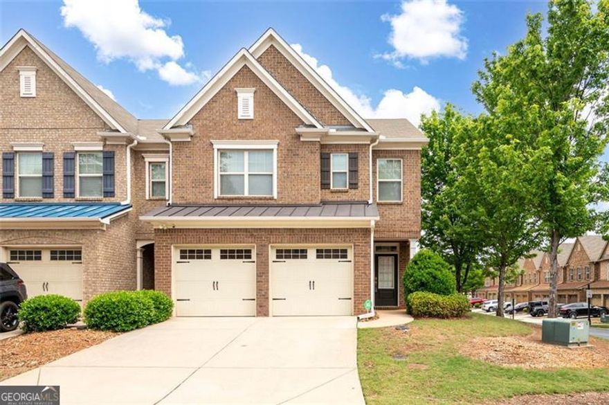 Gorgeous End-Unit Brick Townhome in Prime Marietta Location! Don't miss this beautifully maintained end-unit townhome in the desirable Caswell Overlook community! This 3-bedroom, 2.5-bath brick home sits on a private corner lot and features a 2-car garage, fenced backyard, and standout updates throughout.  Step inside to gleaming hardwood floors on the main level and a bright, open layout. The chef's kitchen is a highlight, boasting granite countertops, stainless steel appliances, tile backsplash, and a spacious dining area filled with natural light-perfect for hosting and everyday living.  Upstairs, you'll find a versatile loft ideal for a home office, media room, or hobby space. The spacious Owner's Suite is a true retreat with a spa-inspired bath featuring a double vanity, soaking tub, and separate shower. Two additional bedrooms and a full bath offer space for family or guests.  Enjoy the privacy and extra light that comes with being an end unit, plus the fully fenced backyard adds a peaceful spot to relax or entertain. A main-level laundry room and attached 2-car garage add everyday convenience.  Community amenities include a pool and playground, with landscaping and water covered by the low monthly HOA. Located minutes from I-75, Truist Park, Dobbins Air Reserve Base, shopping, dining, and golf, this home offers comfort, style, and unbeatable convenience in Marietta.