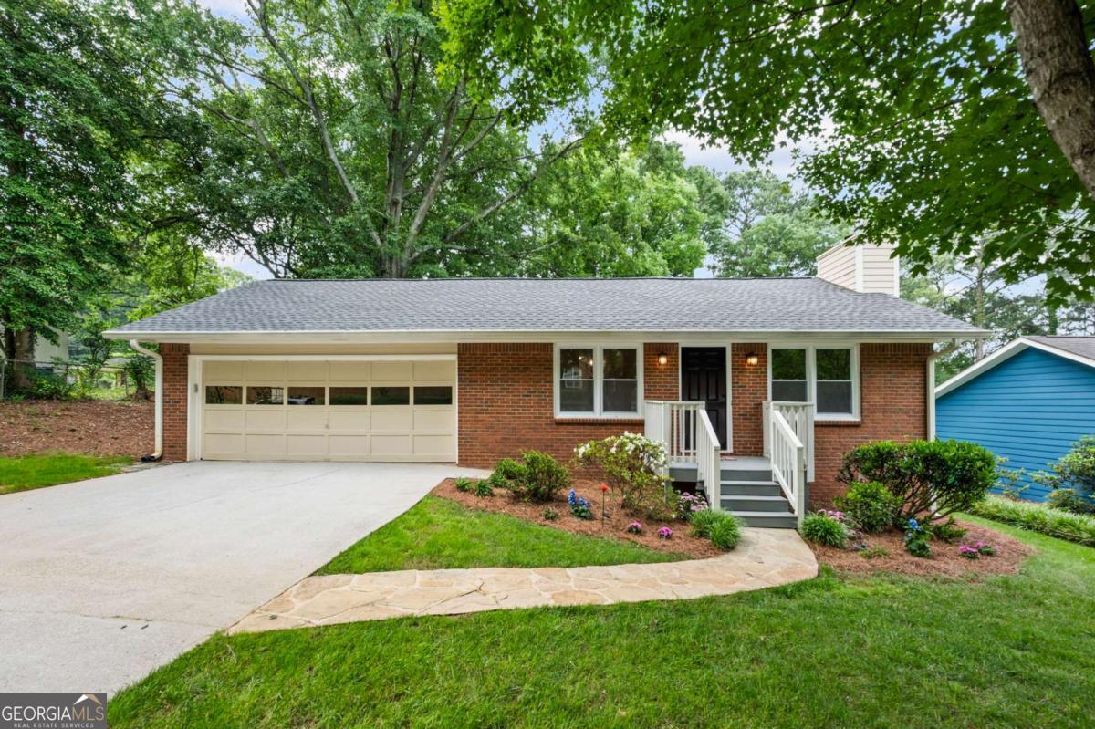 Classic 3BR/2BA ranch on a quiet, tree-lined street with beautifully landscaped 3/4-acre level lot. Enjoy open-concept living with new LVP flooring throughout, fresh interior paint, new light fixtures, and all-new windows. The refreshed kitchen features painted cabinets, new granite countertops & subway tile backsplash, a deep stainless steel sink, new dishwasher, and range. The primary suite includes an updated ensuite bath, and the hall bathroom offers a walk-in tub-perfect for post-workout recovery. Outside, enjoy a spacious level backyard with mature trees and an inviting patio ideal for entertaining. Additional features include a 2-car garage and unbeatable location: walk to the corner coffee shop, 3.2 miles to Emory Decatur medical complex, and under 2 miles to the new Lulah Hills development. Convenient to I-285, historic Decatur, shopping, and dining.