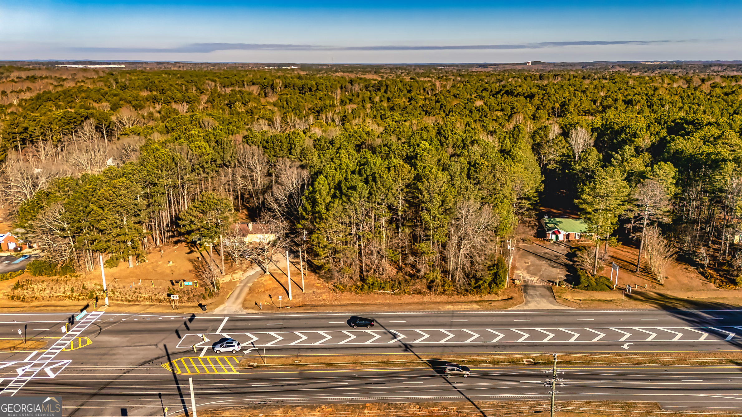 This is a fantastic 2 acre potential commercial lot located between Thomas Crossings and Newnan.  Build your own building and business or there are adjoining properties for sale making thi a perfect lot for expansion and or additional business parking. Over 37k vehicles per day pass by.