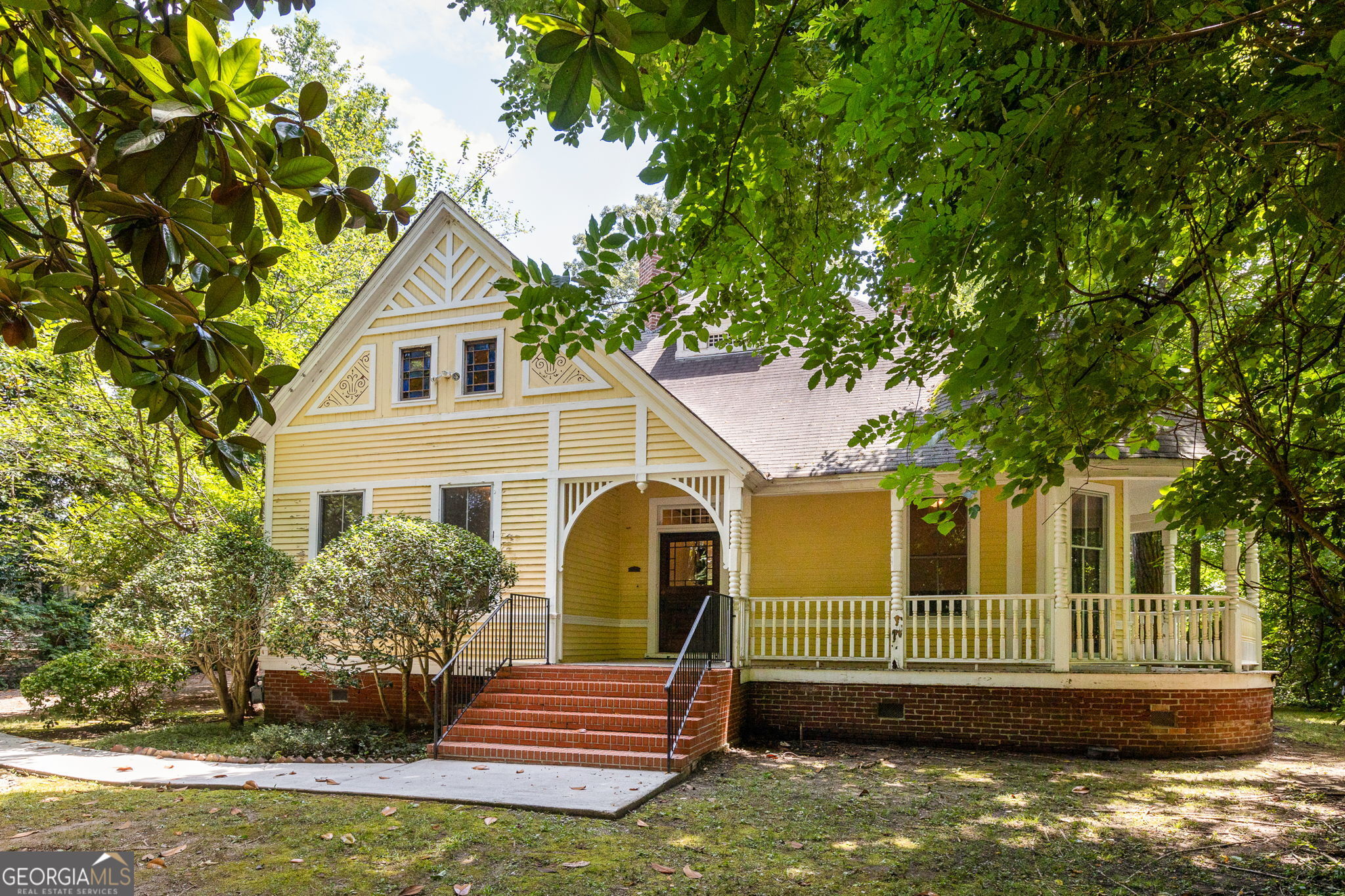 Charming Turn-of-the-Century Victorian Cottage in Downtown Decatur. A rare opportunity to own a piece of history in prime South Candler Street location. Step into timeless elegance with this captivating Victorian cottage that blends historic charm with endless potential. This turn-of-the-century gem sits on an exceptionally large, deep lot offering both privacy and possibilities. The moment you enter, you'll be enchanted by the soaring ceilings, original windows, wide center hall, original heart pine floors and exquisite period trim work that showcases the craftsmanship of a bygone era. Six original fireplaces serve as stunning focal points throughout the home. The home has three generously sized bedrooms, including a large primary suite with ample storage, and a large laundry room. The wraparound front porch invites leisurely afternoons, while the back porch extends your living space into the large, fenced yard. A deep front yard creates a private oasis, buffering you from the street while maintaining the neighborhood's walkable charm. The expansive lot presents exceptional opportunities ? ample space for a future pool, potential for an ADU (Accessory Dwelling Unit), or room to create your own private estate in the heart of Decatur. This home is positioned to have the best of both worlds: enjoy the tranquil, tree-lined setting of South Candler Street while being just steps away from vibrant downtown Decatur. Walk to acclaimed restaurants, boutique shopping, farmers markets, and community events ? all while returning home to your historic sanctuary. This rare combination of historic charm, generous lot size, and premium location creates an exceptional opportunity. Whether you envision restoring this Victorian beauty to its original grandeur or thoughtfully updating it for modern living, the bones are spectacular, and the potential is limitless. Don't miss this chance to own a piece of Decatur's architectural heritage on one of the most desirable streets in the city.
