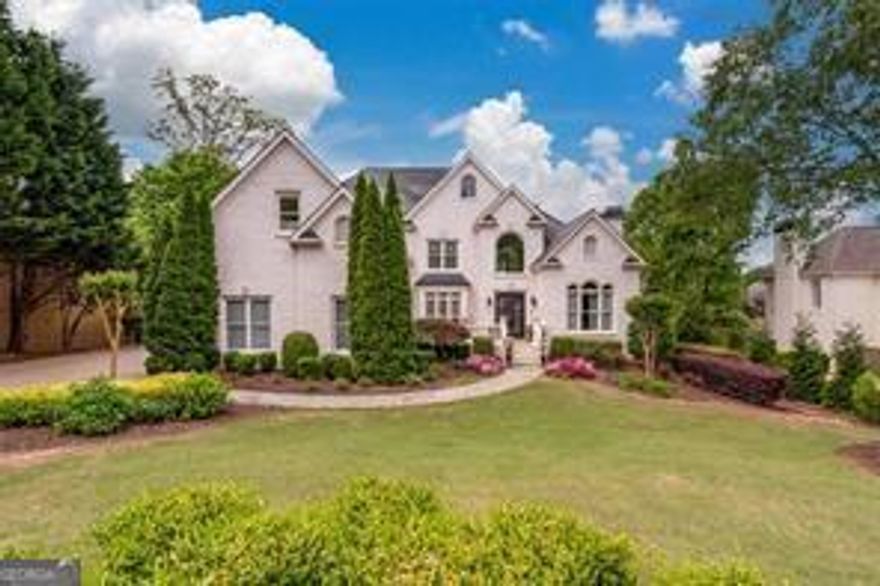 Imagine breathtaking sunsets from this executive lakefront home! A grand two-story foyer and family room offer stunning lake views. The spacious kitchen boasts a large island and a cozy keeping room, both overlooking the water. The main level features a luxurious master suite, while the upper level includes four additional bedrooms and three baths. The finished terrace level offers a bedroom, bathroom, gym, and direct access to a spectacular outdoor retreatCowith a swimming pool, fireplace, and ample space for entertaining.