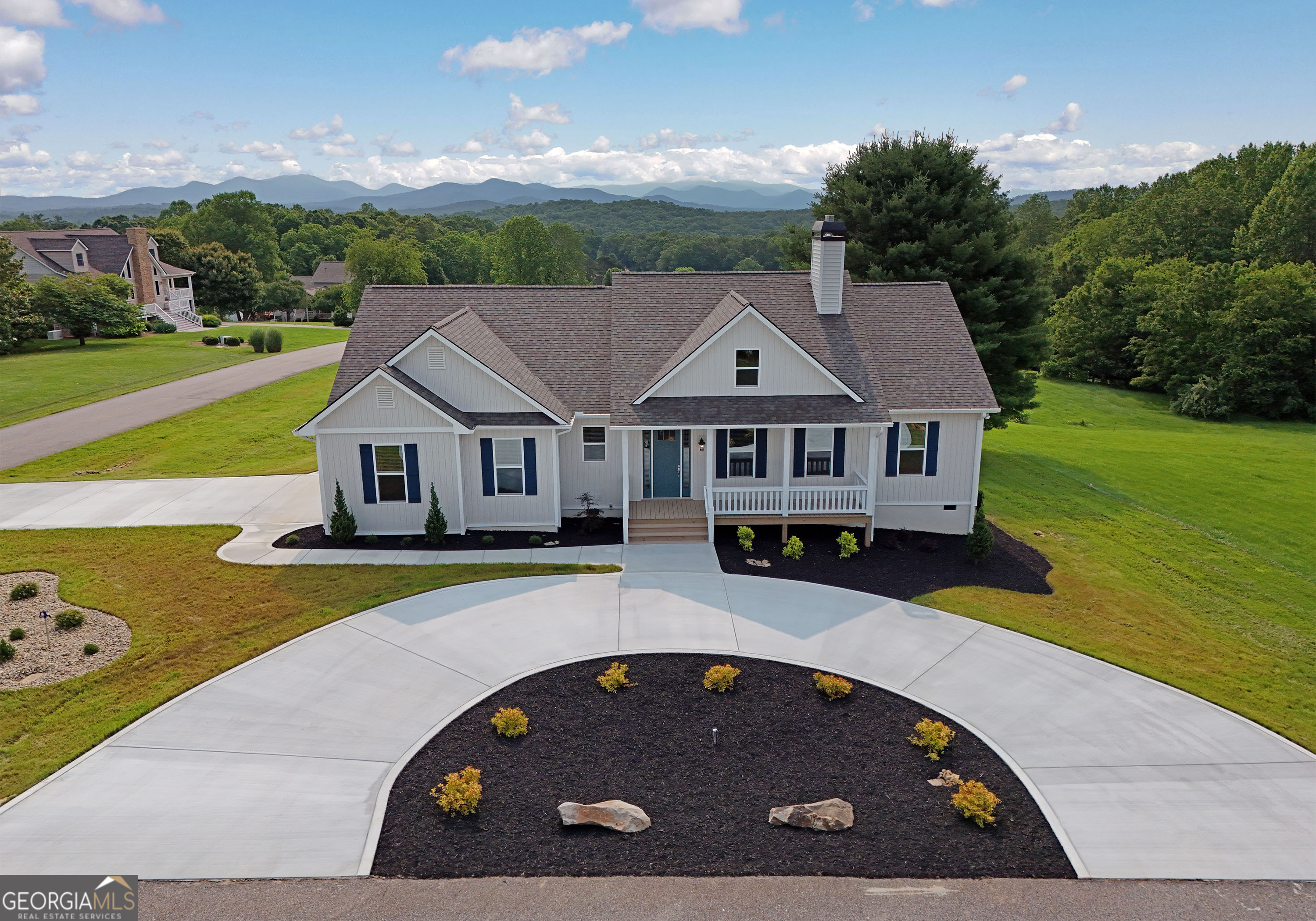 Experience STUNNING LONG RANGE VIEWS of Brasstown Bald from this NEW CUSTOM BUILT 3BR/2.5BA home featuring 10' CEILINGS, GRANITE countertops, QUALITY CABINETRY and a beautiful vented STONE FIREPLACE w/ gas logs. Nestled in a QUIET NEIGHBORHOOD, this home boasts professional LANDSCAPING, CEMENT CIRCULAR DRIVEWAY, custom WINDOW COVERINGS and is still under WARRANTY. A rare blend of elegance, comfort, and peace of mind. Huge crawlspace and attic for added STORAGE. LAKE and boat ramp access very close by. Voluntary $75/yr neighborhood maintenance fee.