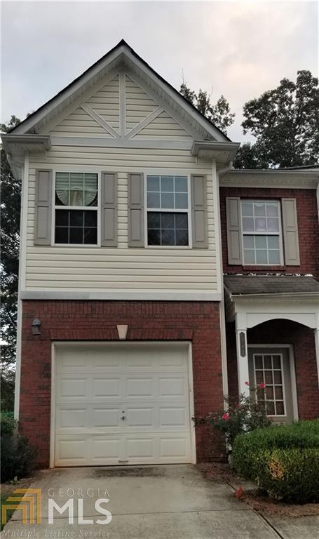 Quiet, well-maintained gated townhouse community on a cul-de-sac street. Highly desirable end unit with backyard facing park-like common area. Foyer opens into breakfast area and spacious kitchen with generous counter space and view to large fireside great room. Beautiful architectural details, including custom moldings and arched doorways. Upstairs, primary suite with separate soaking tub and shower and walk-in closet. Two additional bedrooms on the second floor, an additional bath, and a convenient upstairs laundry room. Family room opens to backyard patio area.One car garage, driveway and parking pad for additional parking. Convenient to I-20, and shopping at Panola and Wesley Chapel.